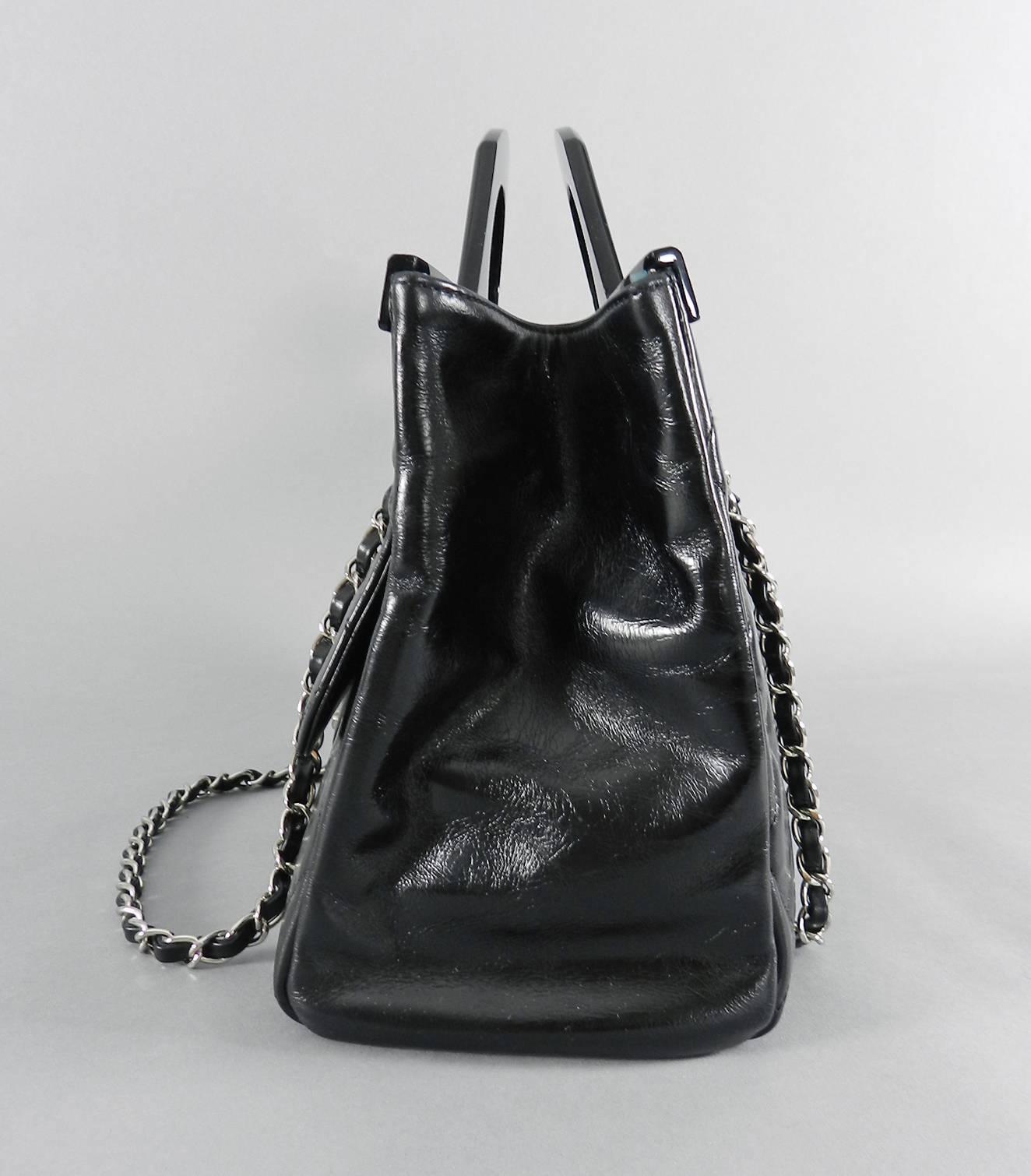 Chanel 15B Small Glazed Black CC delivery tote.  Double resin handle design, open tote style that closes with a magnetic clasp tab, and one small zippered interior compartment.  Body of bag measures about 12.5 x 8 x 5.25