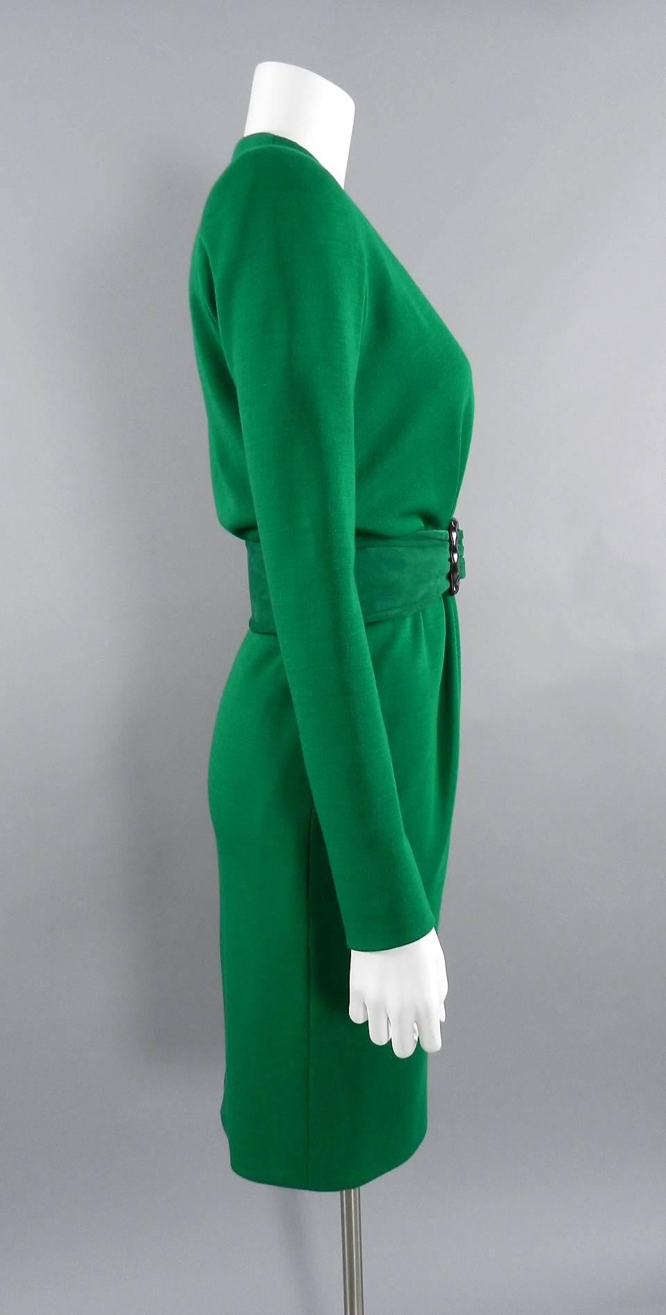YSL Yves Saint Laurent Haute Couture Vintage 1990's Green Wool Knit Jersey Dress.  Fastens at centre front waist with hook and eye closures, zipper closures at wrists, matching suede belt with wood buckle.  Excellent clean pre-owned condition.  To