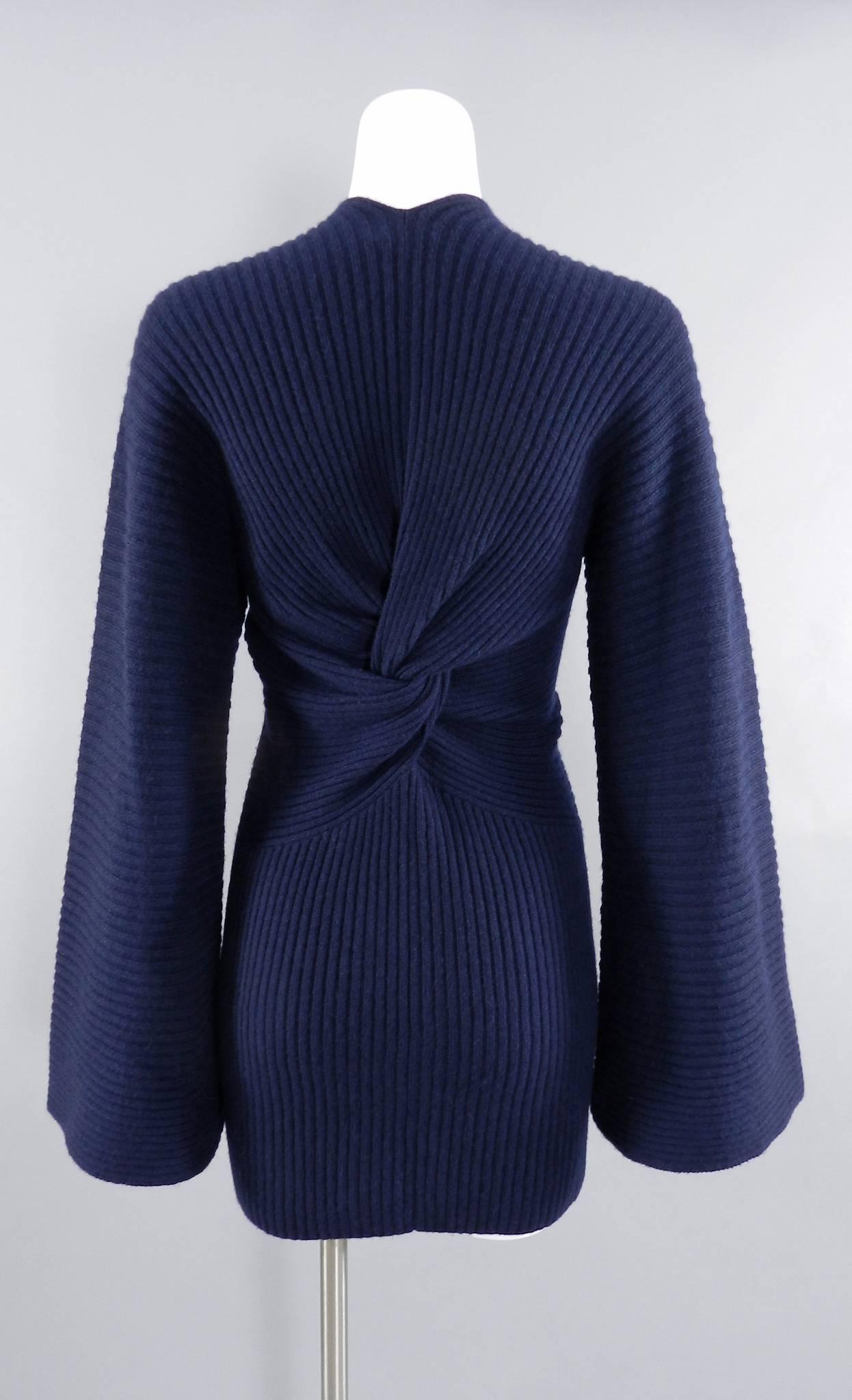 Chanel navy ribbed cashmere sweater with bell sleeves and knot back.   Tagged size FR 40 (about USA 8).  To fit 34-36