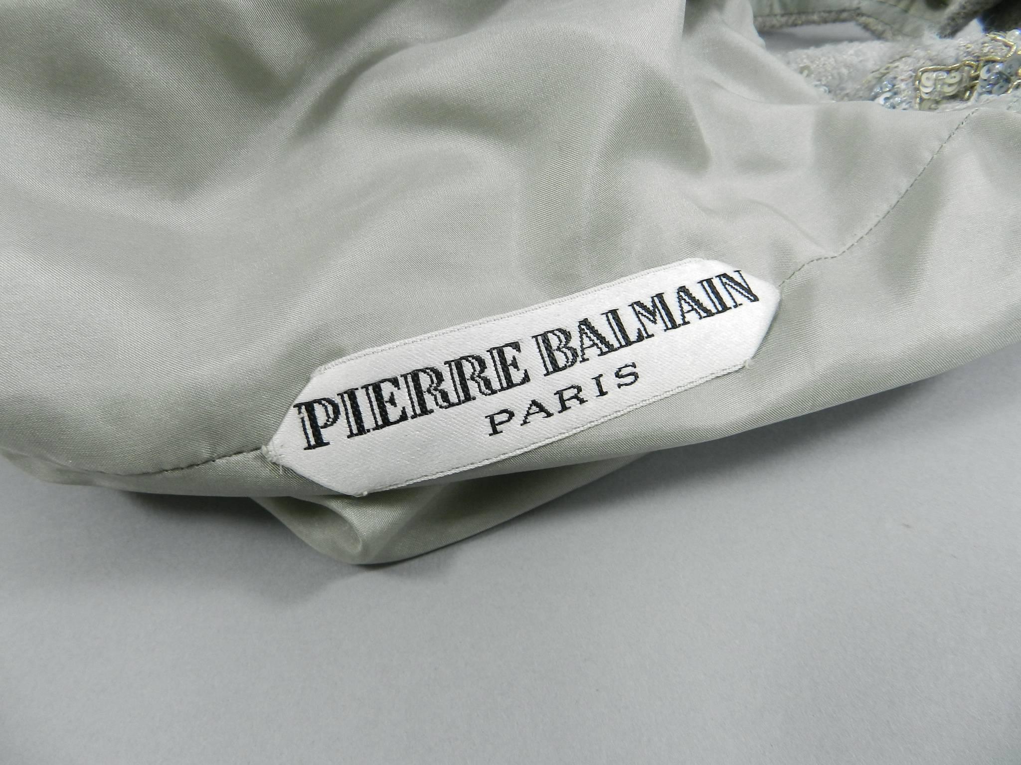 Pierre Balmain haute couture dress by Oscar de la Renta.  Circa late 1990's. Grey wool wiggle dress decorated with Maison Lesage sequins, metal embroidery, and glass seed beads.  Fully lined in silk. USA size 6. To fit 36