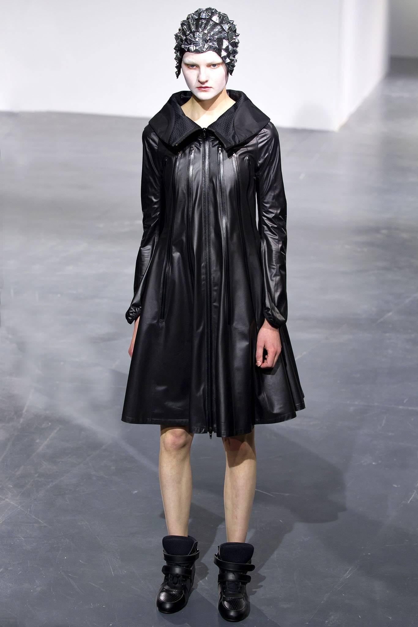 Junya Watanabe Comme des Garcons Spring 2013 Black Runway Nylon Zipper Coat.  Lined with sheer nylon mesh interior, stand up collar, zippers that can be worn undone to expose sheer mesh underneath. Tagged size USA M (best for USA 4 / 6).  To fit