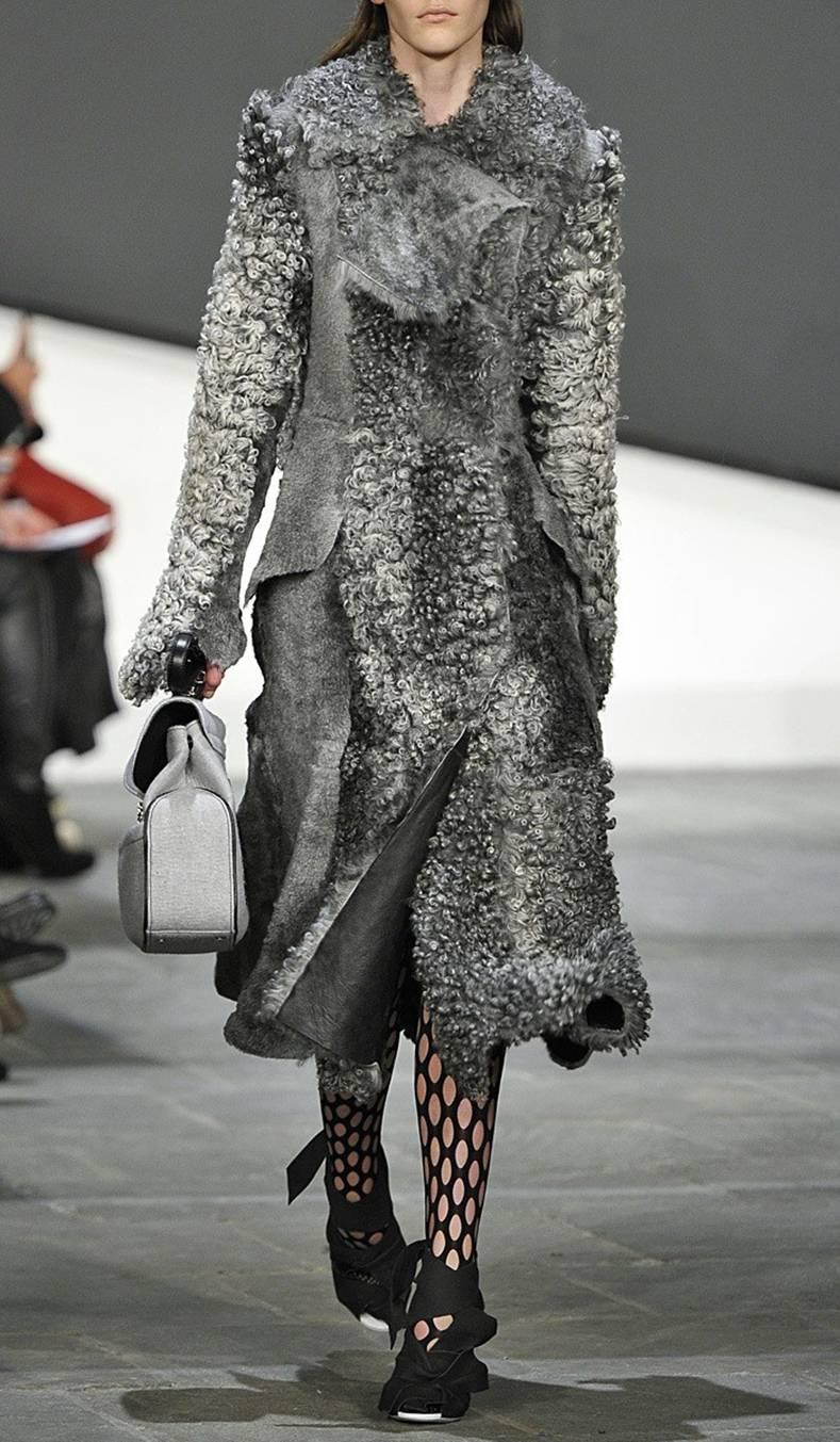 Proenza Schouler Fall 2015 Runway Swakara Gray Lamb Shearling Coat.  Original retail $9000+. Fastens down front with hidden hook and eye closures, has side hip pockets and princess cut design. Tagged size USA 4 but fits oversized and recommended for