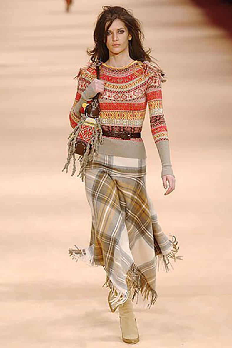 Alexander McQueen Fall 2005 Runway Fair Isle Cardigan Sweater.  Runway photos show a pullover version but this is a cardigan with buttons down front.  Beige, red, brown, yellow wool knit sweater with mother of pearl buttons.  Tagged size M but is