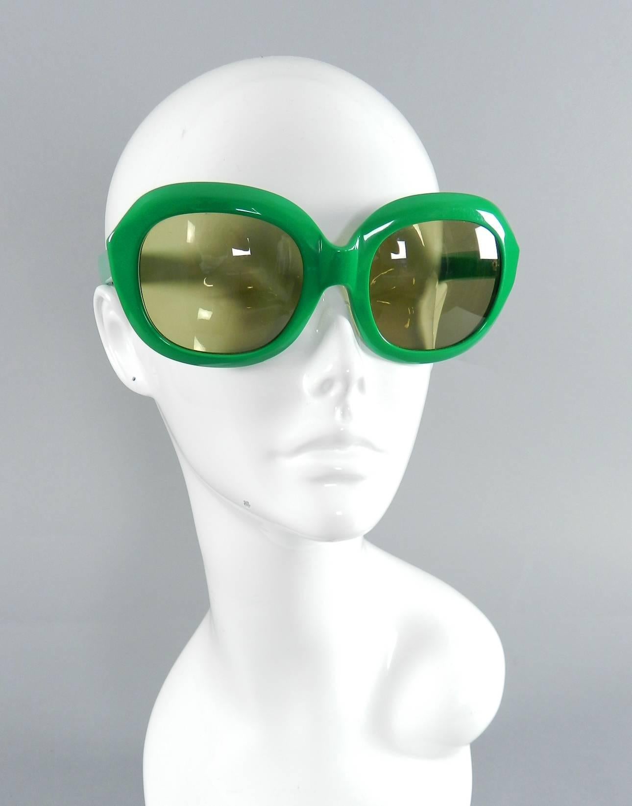 Vintage 1970's Givenchy green sunglasses.  Marked Givenchy Paris on one interior arm and Viva on the other. Front face measures 6.25
