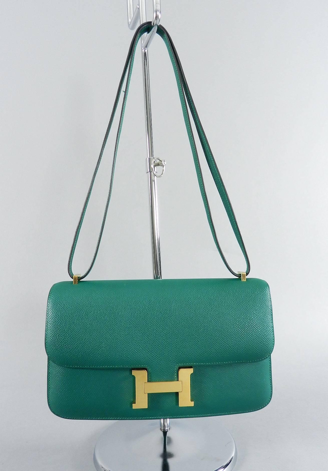 Hermes constance elan bag.  Malachite green color with goldtone metal hardware in Epsom leather.  Date stamp R in square for production year 2014. 
 Body of bag measures 25 x 15 x 6 cm and strap has a 12" drop when doubled and 21.5" drop