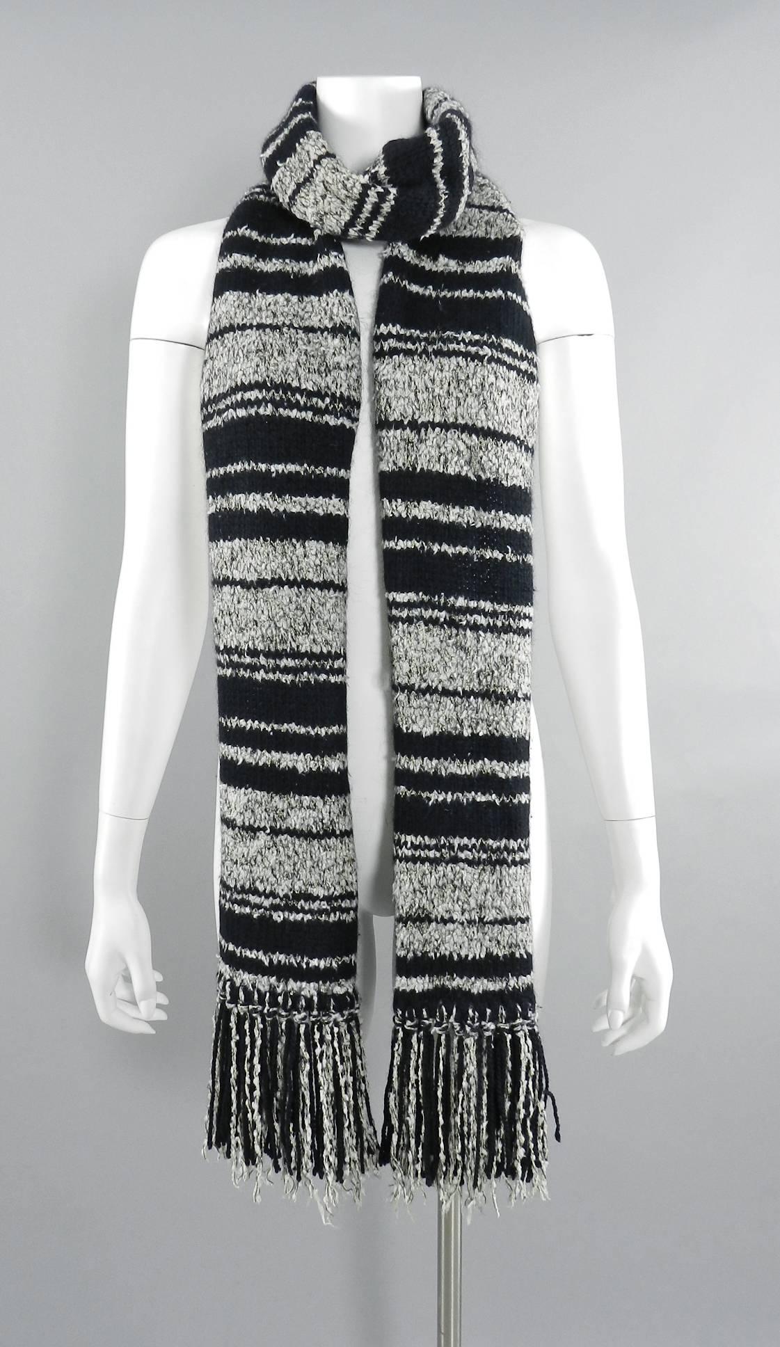 Chanel 10A black and white long knit fringed scarf. Measures 8