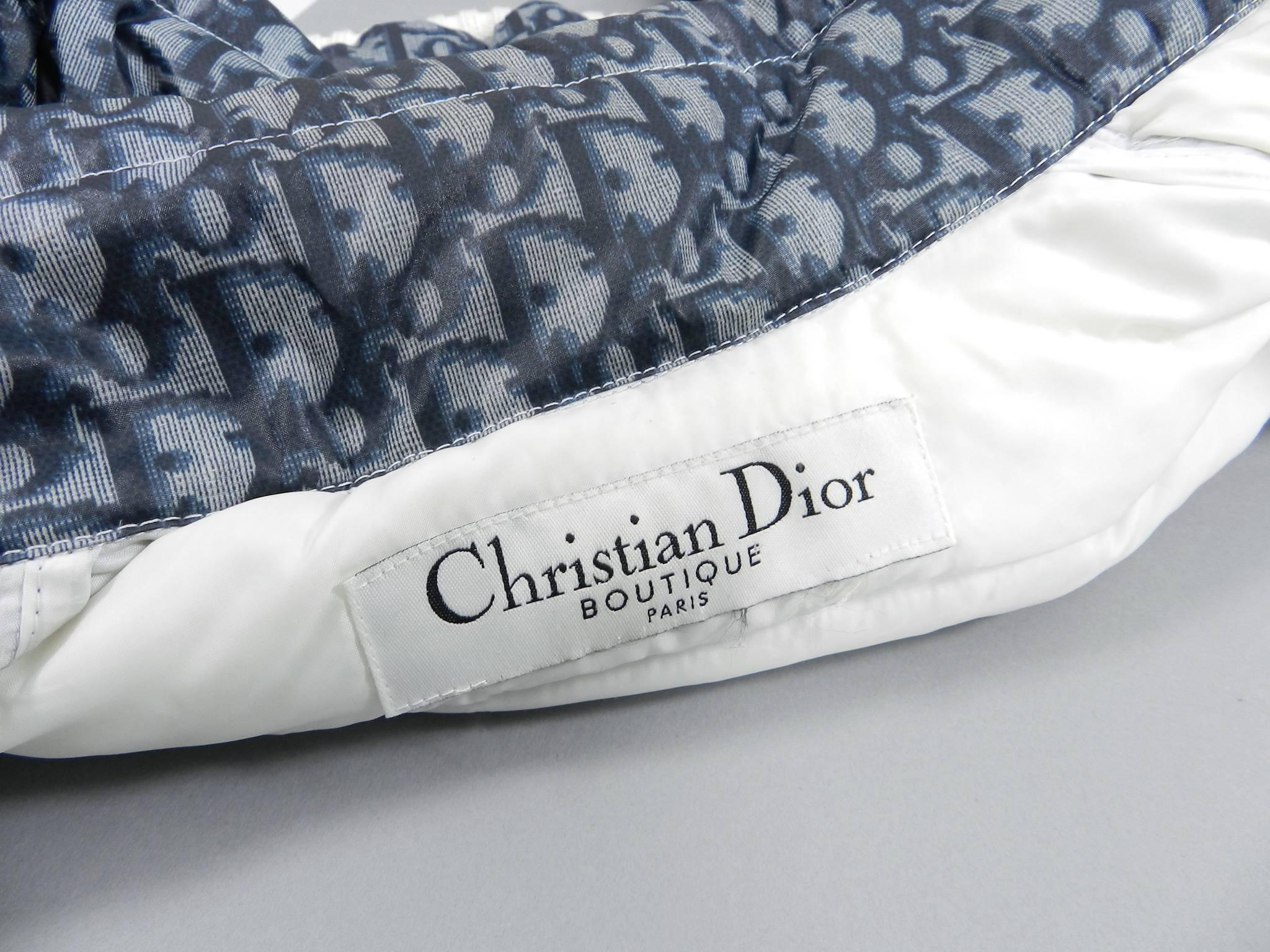 Christian Dior Fall 2004 blue monogam puffer ski jacket.  Off-white ribbed wool trim.  Size tag is removed but is likely a FR 34 / 36 and best for USA XS size 2.  To fit 32-33