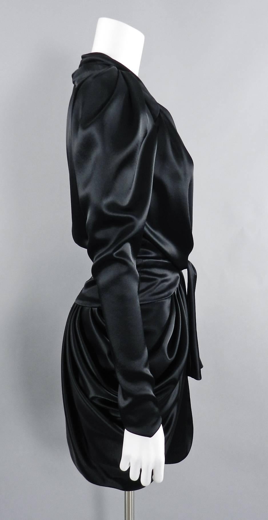 Balenciaga  by Nicholas Ghesquiere Fall 2009 Black Satin Gathered Dress.  Fastens at centre front with hidden hooks and snaps, ties at waist with sash at front, draped skirt, puff shoulders, tapered sleeves.  Tagged size FR 40 (USA 8). To fit