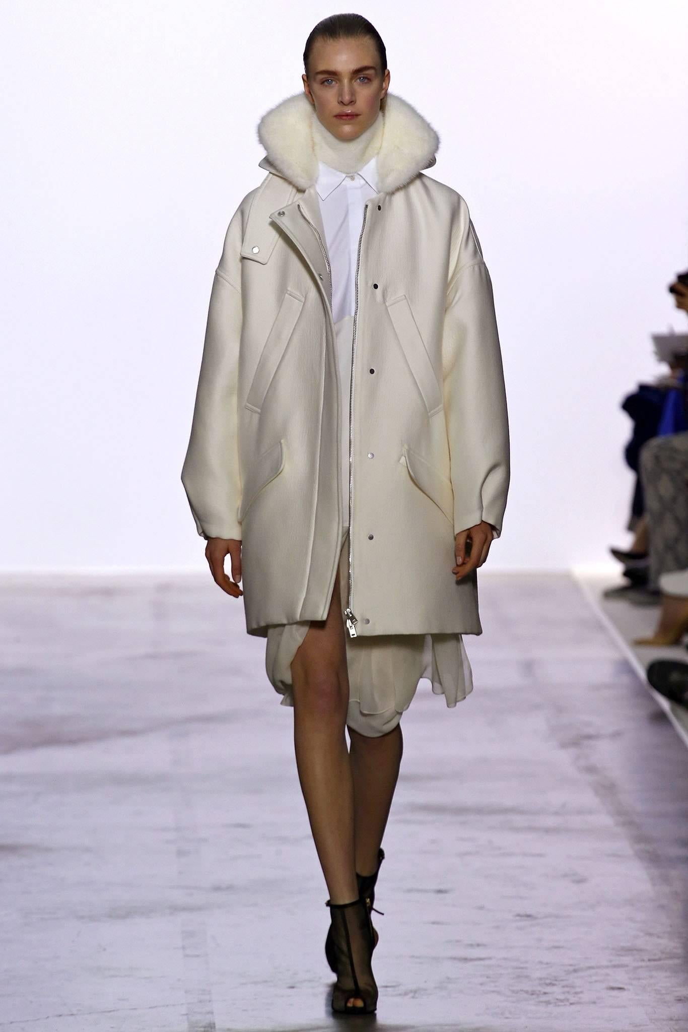 Giambattista Vali Winter White Parka Coat with Fox Fur Trim.  Fall 2013 runway collection.  Original retail price $6690.  Centre front zipper, side hip pockets, silvertone metal snaps down front and at cuffs.  Tagged size IT 40 USA XS but fits