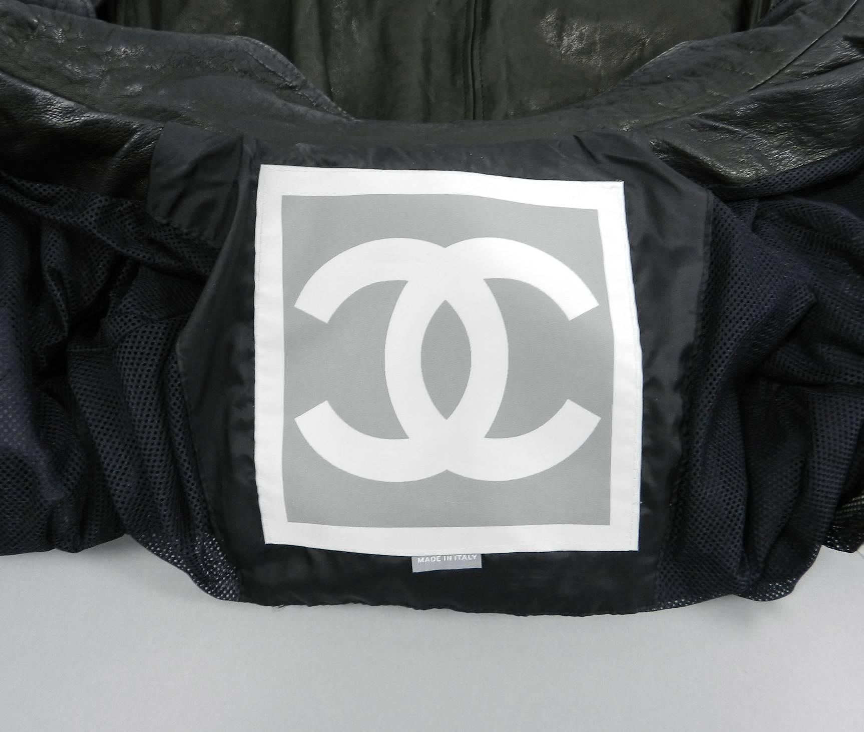 Chanel Sport 07A black distressed leather utility jacket with pockets.  Zippers up centre front and closes with snaps, has elasticized waist, and stand up collar. Tagged size FR 38 (USA 6).  to fit 34