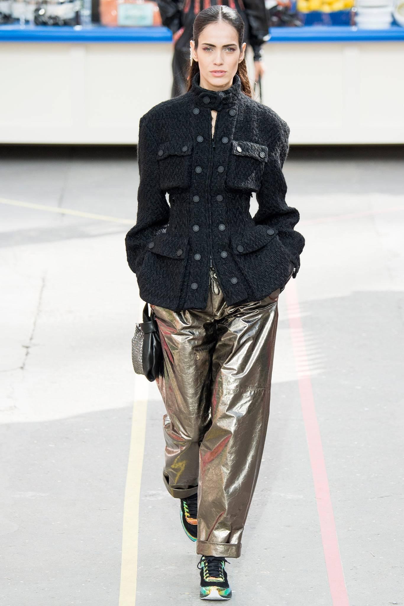 Chanel fall 2014 Supermarket Runway Black Tweed Corset Utility Jacket.  Original retail $8025.  Zippered corset waist design, black enamel bottle-cap CC logo buttons, cargo pockets, centre front zipper.  Thick heavier weight tweed that can be worn