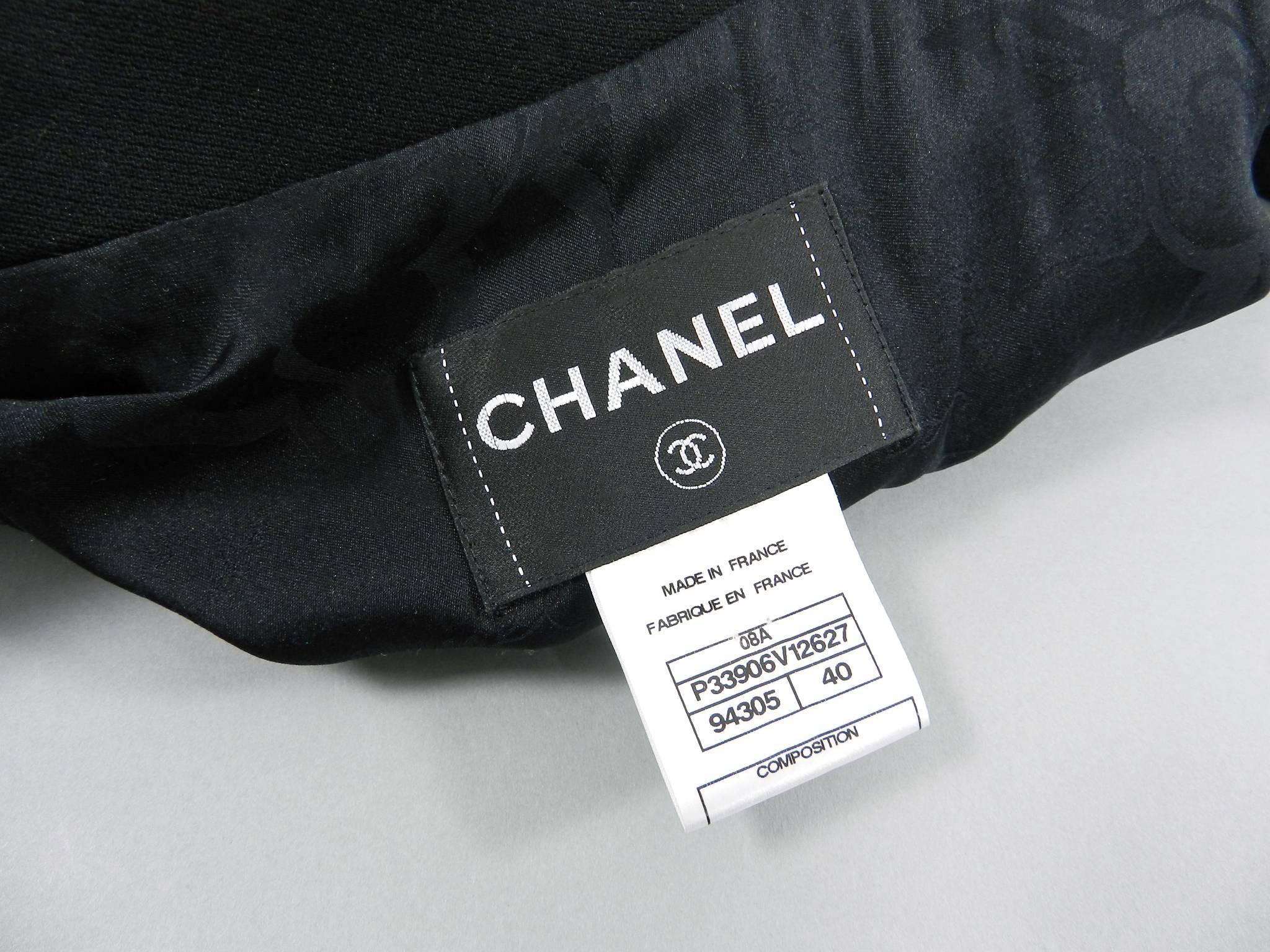 CHANEL 08A Fall 2008 Classic Black Wool Blazer Jacket.  Fastens at front with a single lion head button, has notched lapels, and side hip pockets. Tagged size FR 40 (USA 8).  to fit 34-35