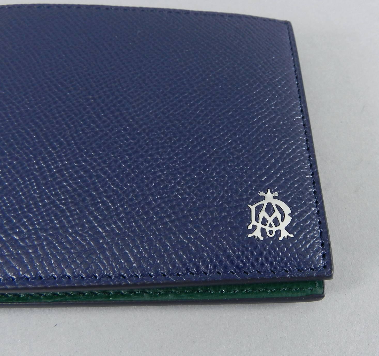 DUNHILL Mens Blue and Green Bifold Leather Wallet.  Signature silver metal logo at bottom right corner.  Original papers still in card slots. Excellent new without tags. Measures 4.25 x 3.75