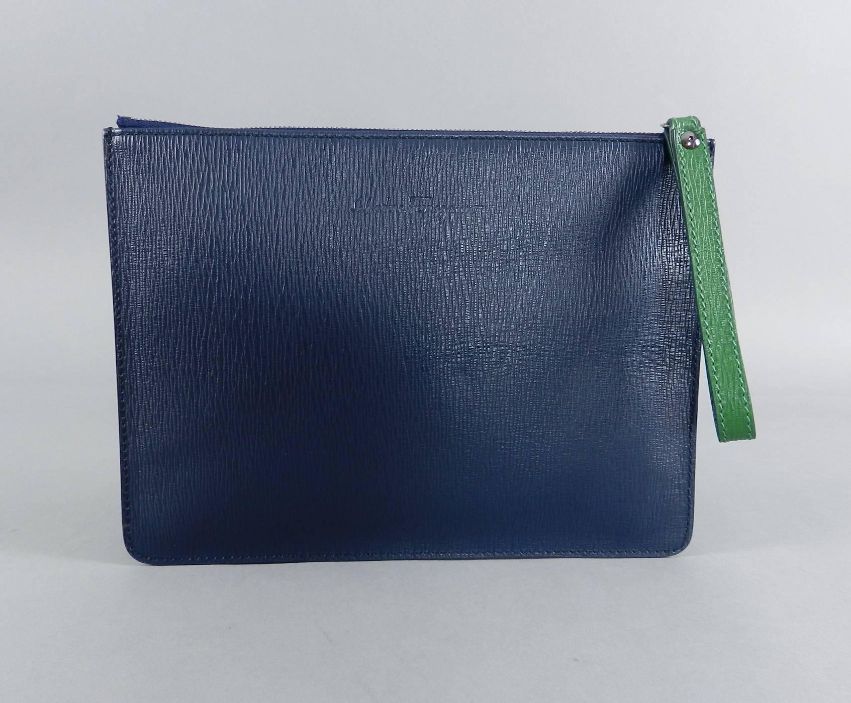 Ferragamo Dark Blue Leather zippered Pouch / Clutch / Document Bag.  Contrasting green trim and wristlet strap.  Dark gunmetal color zipper.  Excellent condition.  Measures 11.25 x 8.25 x 1