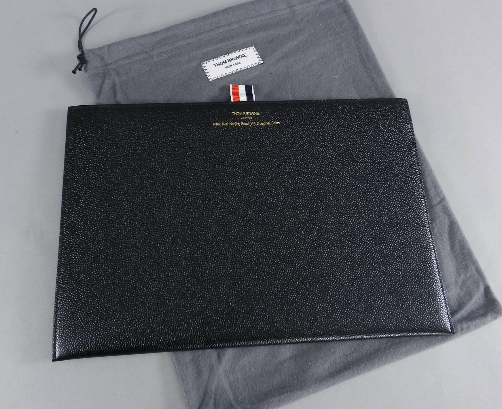 Thom Browne New York Black Leather Flat Document Case / Portfolio / Clutch Bag.  Signed Tom Browne New York, and was purchased at their new Shanghai flagship within the high end Asian department store Reel at 1601 Nanjing Road W. Pebbled leather