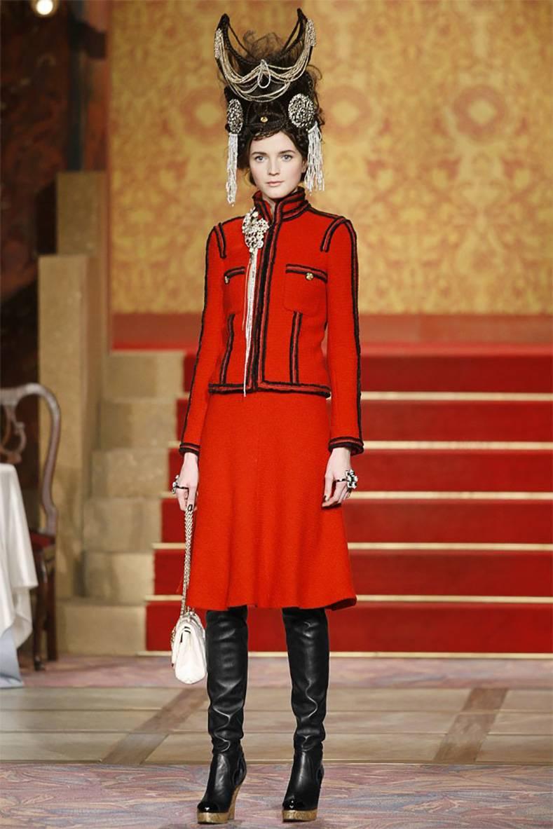 Chanel 09A Moscow Russian Collection Red Runway Skirt Suit.  Iconic pre-fall 2009 runway and ad campaign suit. Fitted bias-cut skirt, front chest pockets, gold zipper closure, and black velvet fantasy trim.  Tagged size FR 38 (USA 6).  Skirt