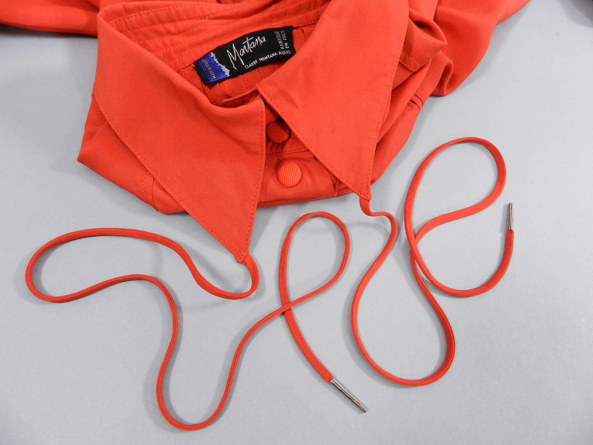 Claude Montana 1980's Tomato reddish orange Shirt with String Collar.  Back of shirt has pin tucked design and garment fastens with snaps. Likely a size FR 36 or 38. Can fit size USA 2/4 as oversized or size 6. Garment measures 46