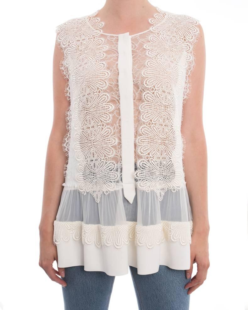 Alberta Ferretti White Sleeveless Blouse with Guipure Lace Applique. Hidden closures down front, guipure lace applique, sheer pleated inset. Marked size IT 44 (USA 8). Garment bust measures 40” and is recommended to be worn by 35-36” bust person. 