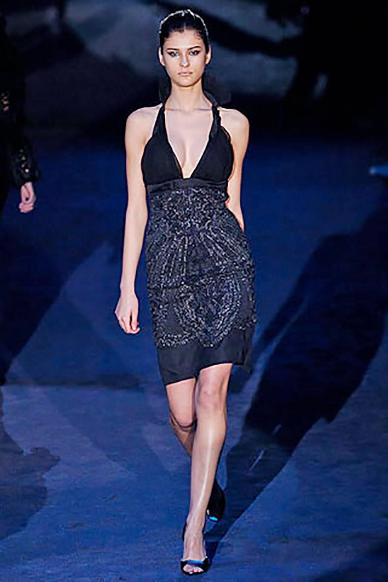 Gucci by Tom Ford AW 2005 runway Beaded Dress.  Stand up ruffled collar that can be worn folded down, silk chiffon overlay at bust, midnight blue skirt with black beaded tulle overlay.  Garment has an invisible side zipper, pleated back vent at