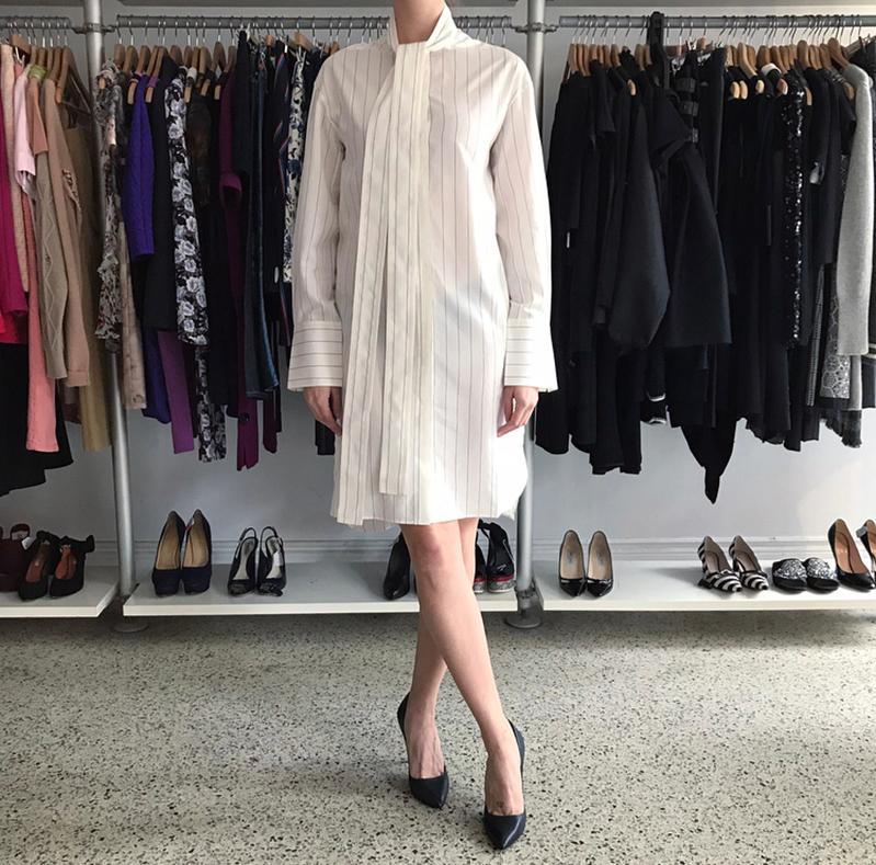 Celine Off White Cotton Pinstripe Shirt Dress.  Original retail price tag of $1700 from Saks Fifth Avenue included. Off white cotton long shirt with thin black stripes.  Kong neck sashes, side pockets on seam.  Marked size FR 36 (USA 4)  But this is