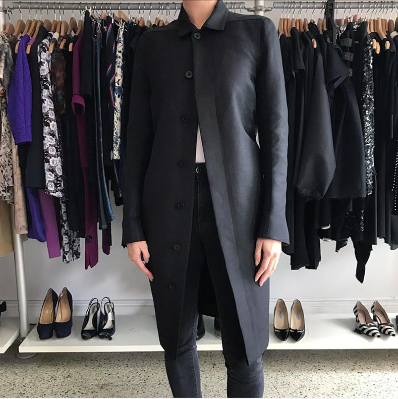 Rick Owens Black Light Straight Cut Coat.  Covered buttons down front,  pointed collar,  side hip pockets,  high back waistband, back centre vent at hem.  Straight -cut design.  Marked size IT44 (fits USA 8). Garment measures 38” at bust and is