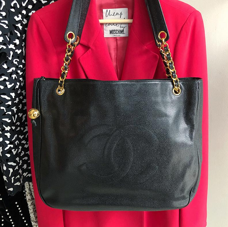 Chanel Vintage 1994 Caviar Leather Large CC Logo Tote Bag.  Goldtone hardware, black satin lined interior, gold quilted CC logo ball zipper pull.  Very excellent near mint clean condition.  3-series for production year 1994-1996.  Includes