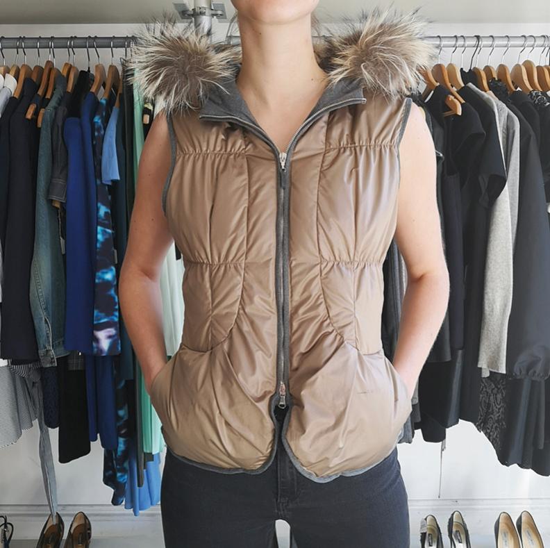 Brunello Cucinelli Light Taupe Puffer Vest with Fur Hood.  Silver metal zipper at front,  fox fur trim hood,  side pockets on seam.  Marked size IT 42 but fits much smaller and is best for USA 2/4 or XS.  To fit 33” at bust,  recommended for about