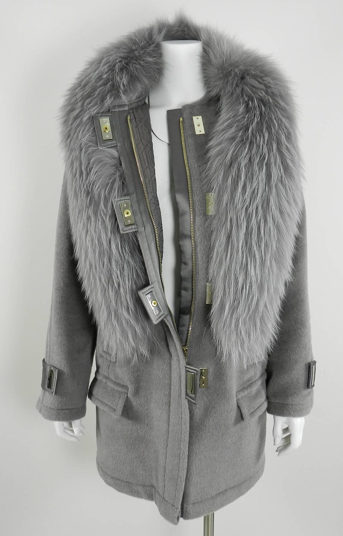 Jason Wu Fall 2014 runway coat. Grey soft wool with fur collar trim. Light champagne goldtone metal plate snaps and zippers. Original retail price $6125+.  Excellent condition - worn once. Size USA 6/8.  Fur is labelled as Dyed Asiatic Raccoon.