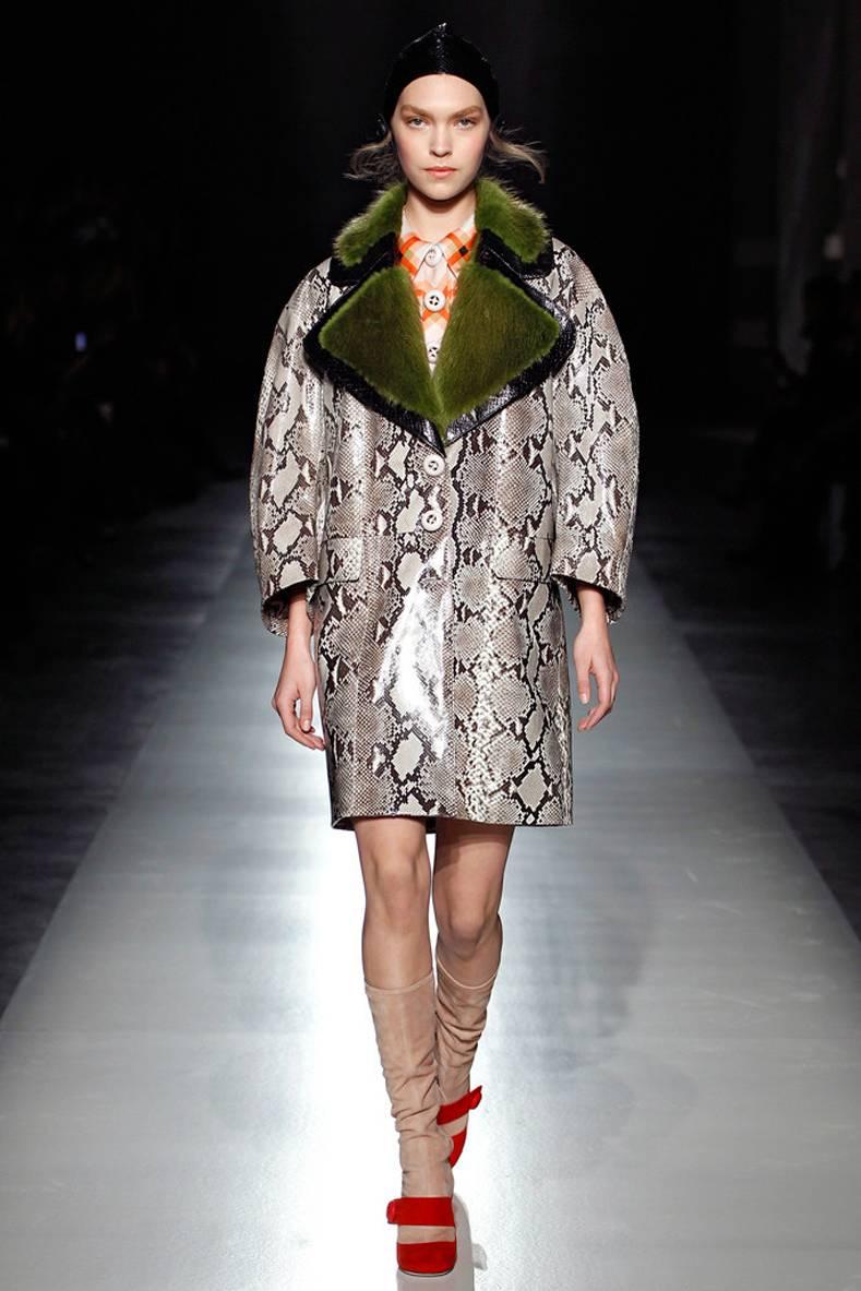 Prada fall 2011 runway and ad campaign coat. Reticulated python body and green dyed beaver fur collar. Excellent condition - worn one if at all. Original price tag is $10,200+.  Tagged size Prada 40. Is cut oversized and is best for a USA 6/8 or 10.