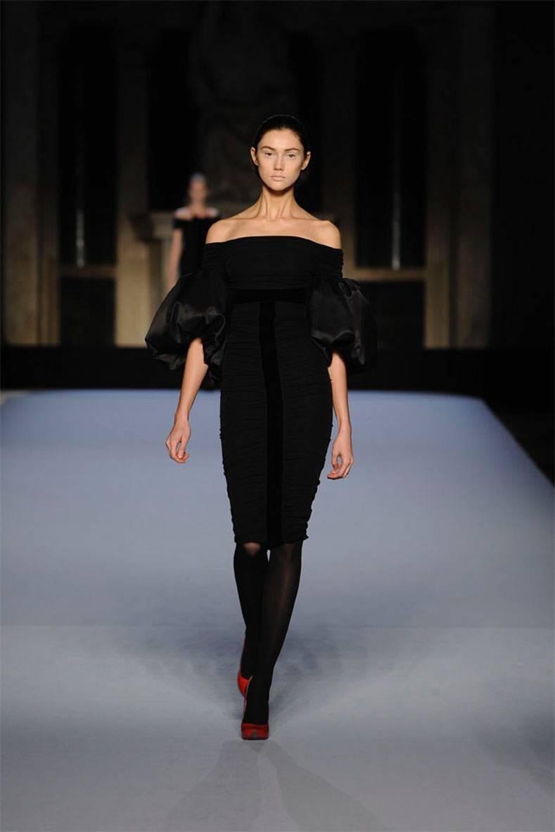 Giambattista Valli black off the shoulder ruched runway dress from the pre-fall 09 collection. Dramatic balloon sleeves with one side in silk tafetta and the other in silk velvet. Centre back zipper. Tagged size IT 40 / XS (USA 0/2). 

Shipping