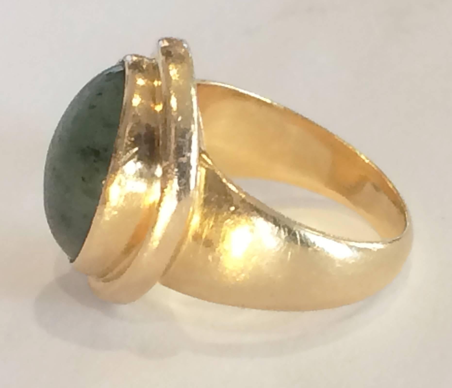 A rare Art Deco Ring by Georg Jensen, in 18ct (750 European Mark), with Nephrite Jade Cabochon set in a full perimeter mount (Design Shape No. 1046). . The primary Hallmarks to the inside, behind the mount, are as follows: The standard Georg Jensen 