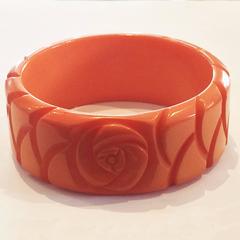 Art Deco solid orange carved bakelite bangle bracelet