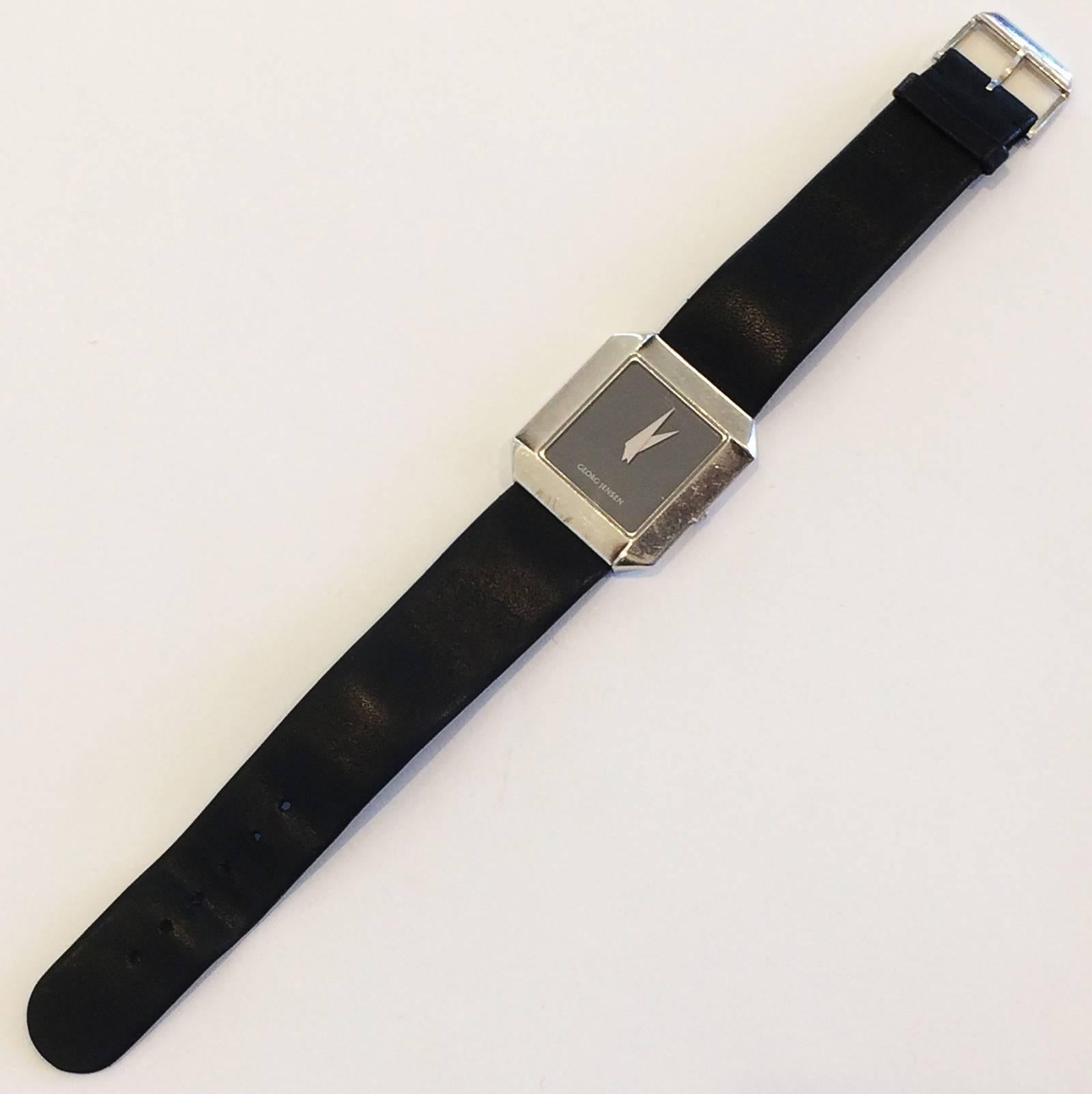 Georg Jensen Slim, Unisex Watch with an Octagonal, Geometric Sterling Silver Case, the Bezel is chamfered and stepped at each corner, black face and having the original Soft Jensen black Leather band with Sterling Silver Clasp. Elegance in its