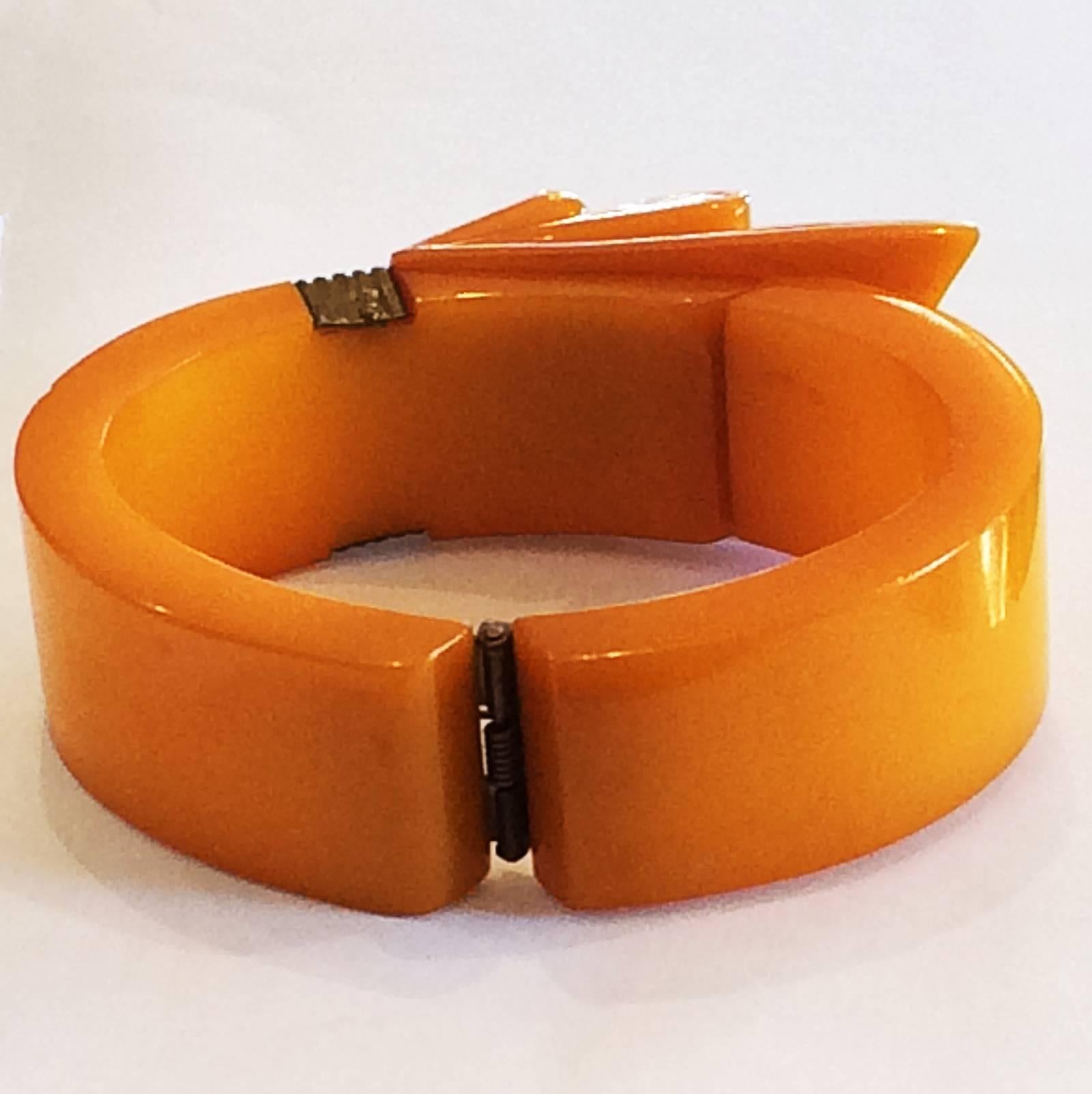 Women's Art Deco Orange Bakelite ribbon clamper or hinged bangle