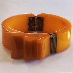 Art Deco Orange Bakelite ribbon clamper or hinged bangle