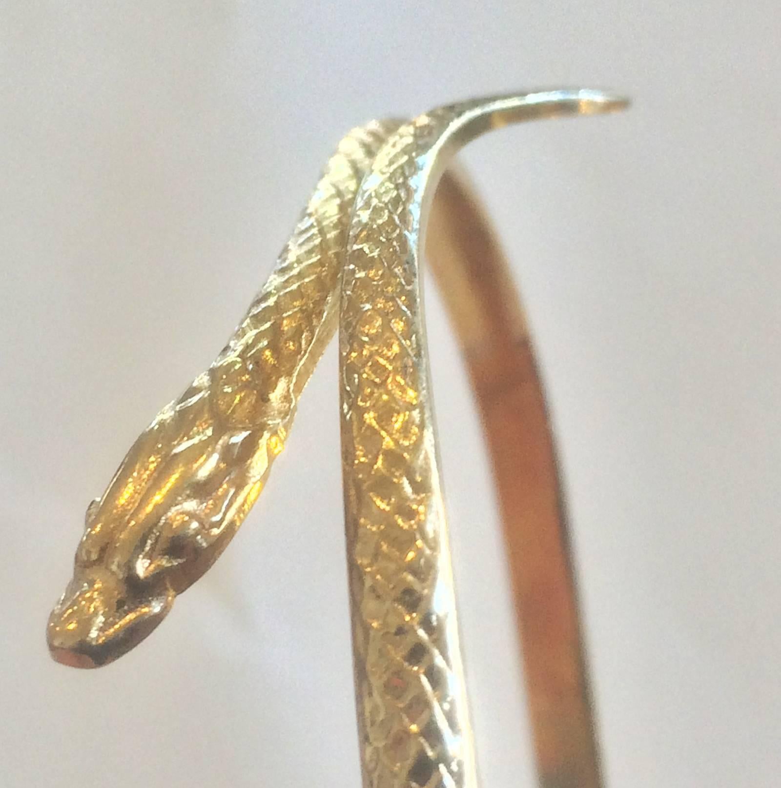 Art Deco Bangle or Cuff in Gold, in the form of a Snake, Hallmarked to outside edge, probably a European mark. Head and Tail are separated so the size is adjustable, smaller or larger, to suit fitting. Excellent condition and all perfect. Tests as