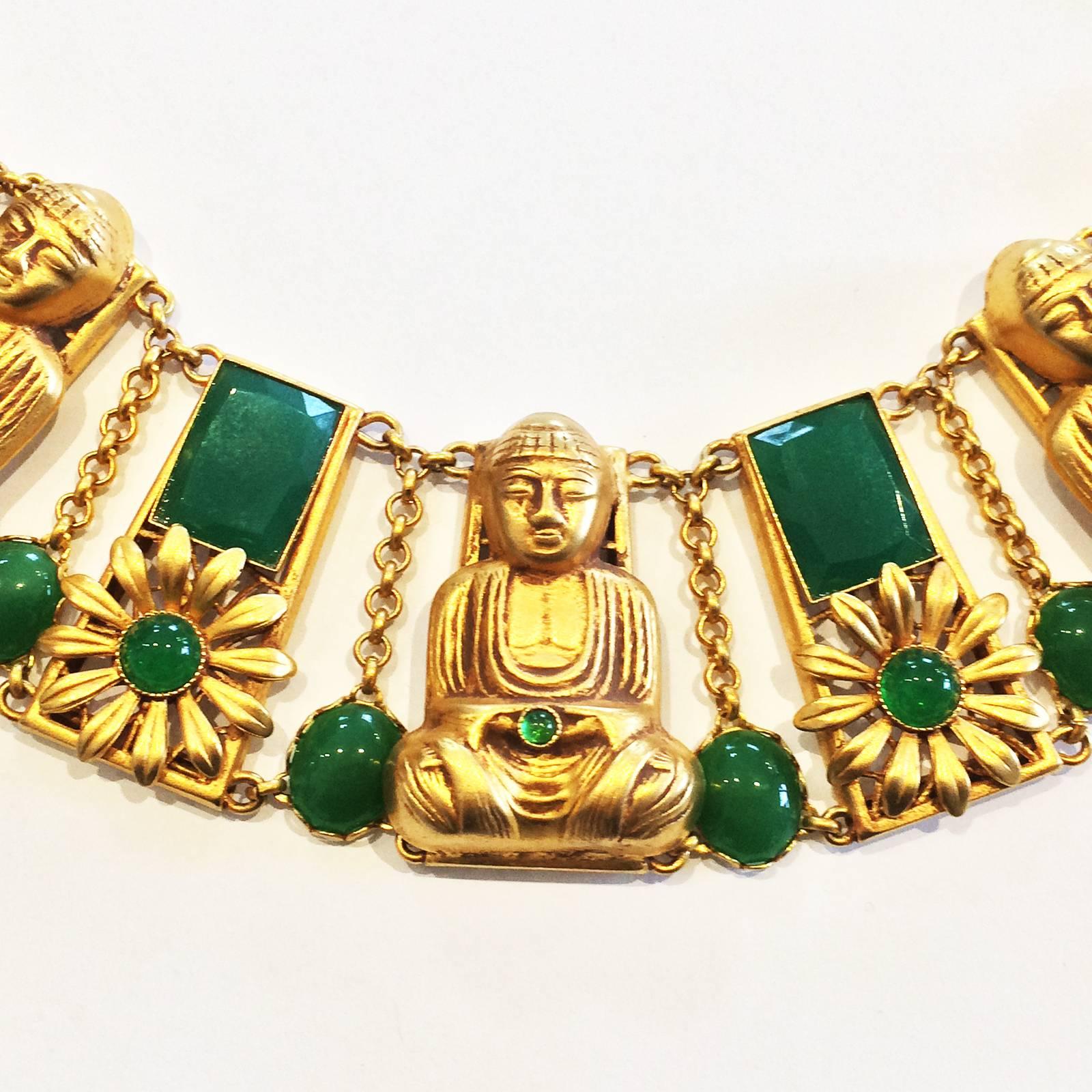 Buddha Necklace by Askew of London, in heavy Gold Plate, Gilt chain overall, inset with the Emerald Green Chrysophase glass, each piece set in fine filigree Frames with each Buddha holding a “Gem”. Separated by gilt frames, each having a facetted