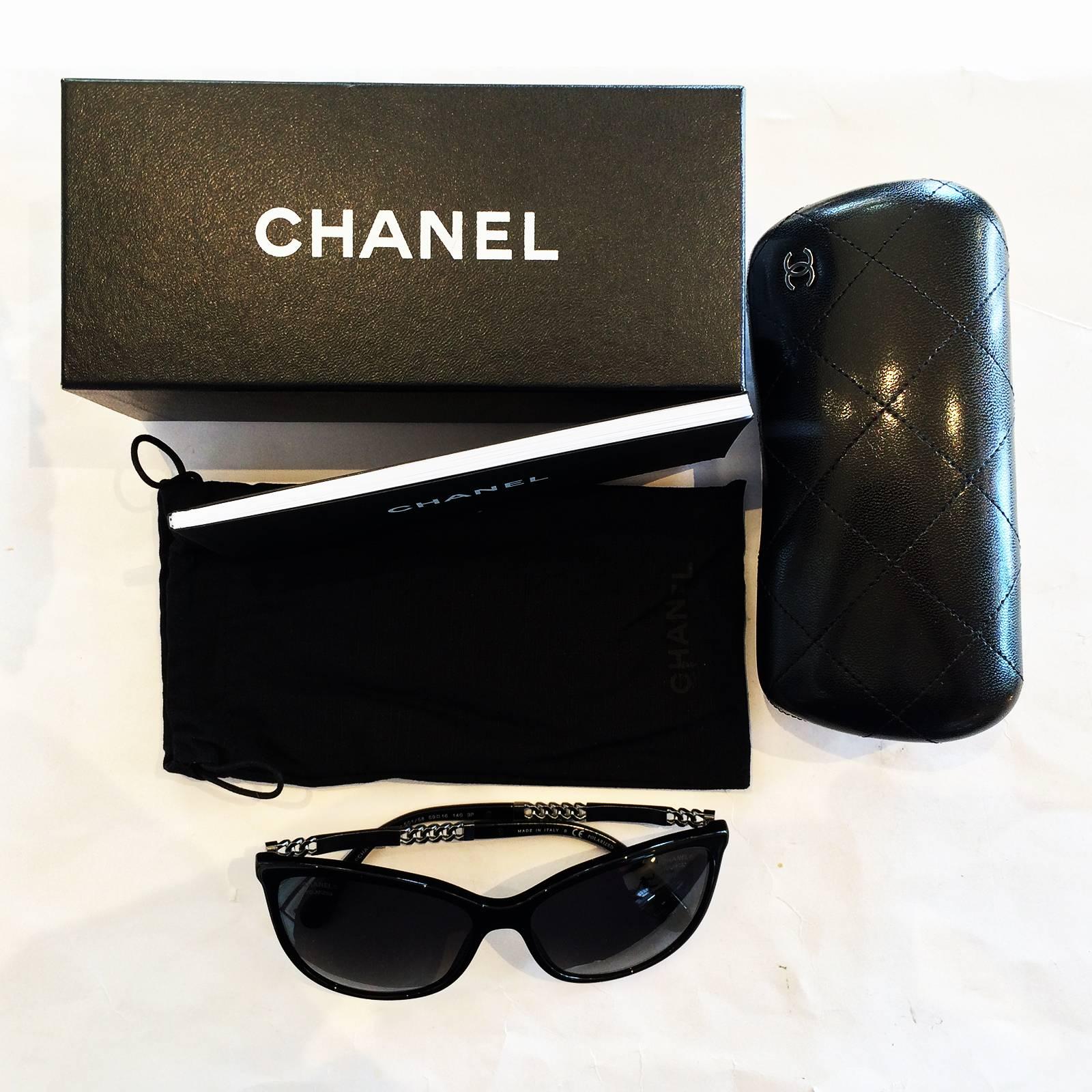 Authentic Chanel Black and Titanium Polarised Sunglasses, Model no  5352 c 501/S7. No scratches or lens damage, totally perfect. Having the Chanel name, between Titanium Chain either side, with this pattern to either side arms, and CHANEL, over