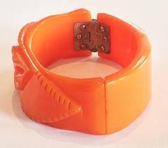 Art Deco Orange pumpkin bakelite hinged carved clamper bracelet