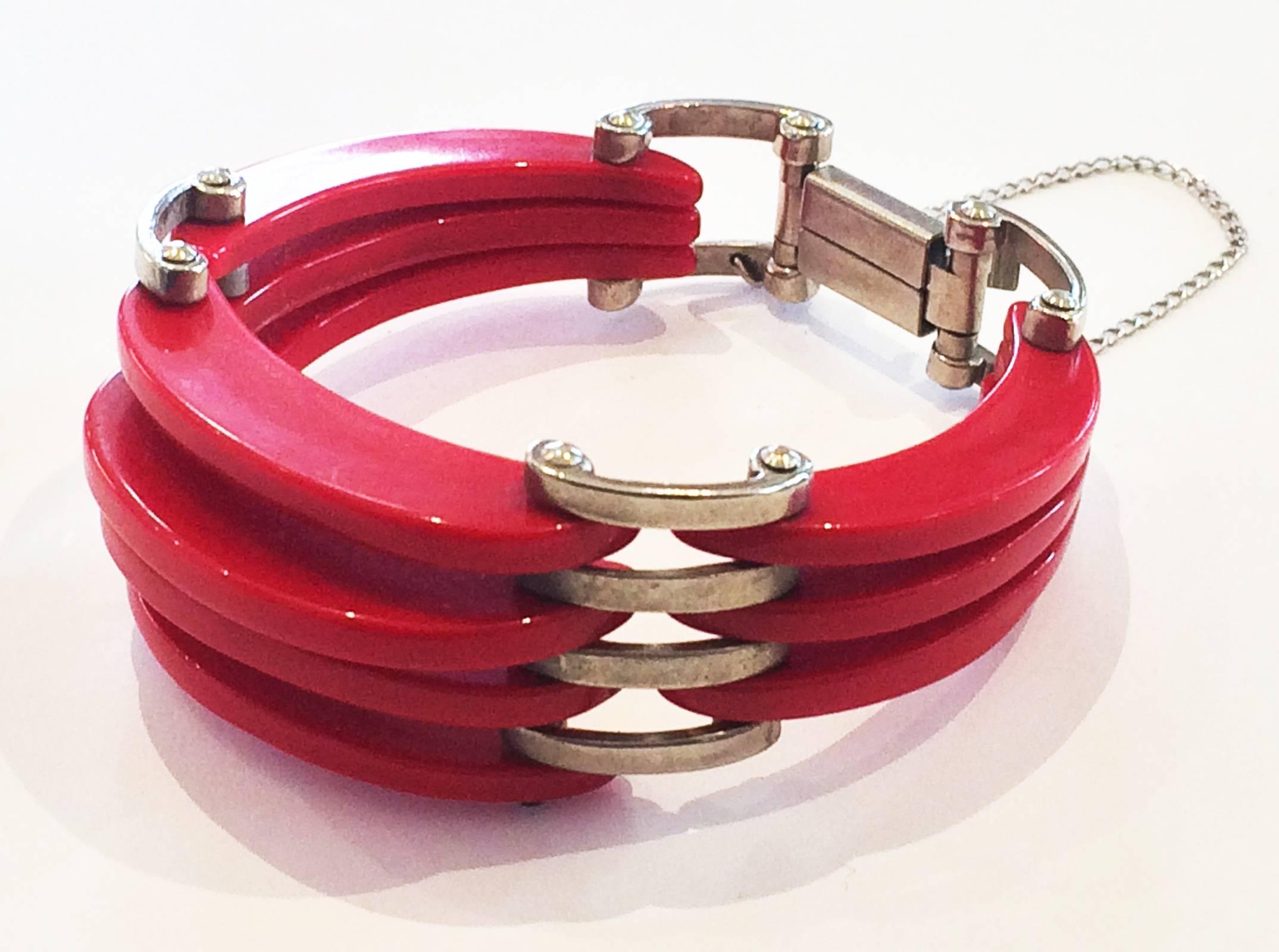 Art Deco Bracelet in layered and tapered Red Bakelite , original nickel finish and spacers, with nickel swivel pin axels, and safety chain, a truly wonderful piece. All in fantastic original condition with no damage or restoration, and clasp is in