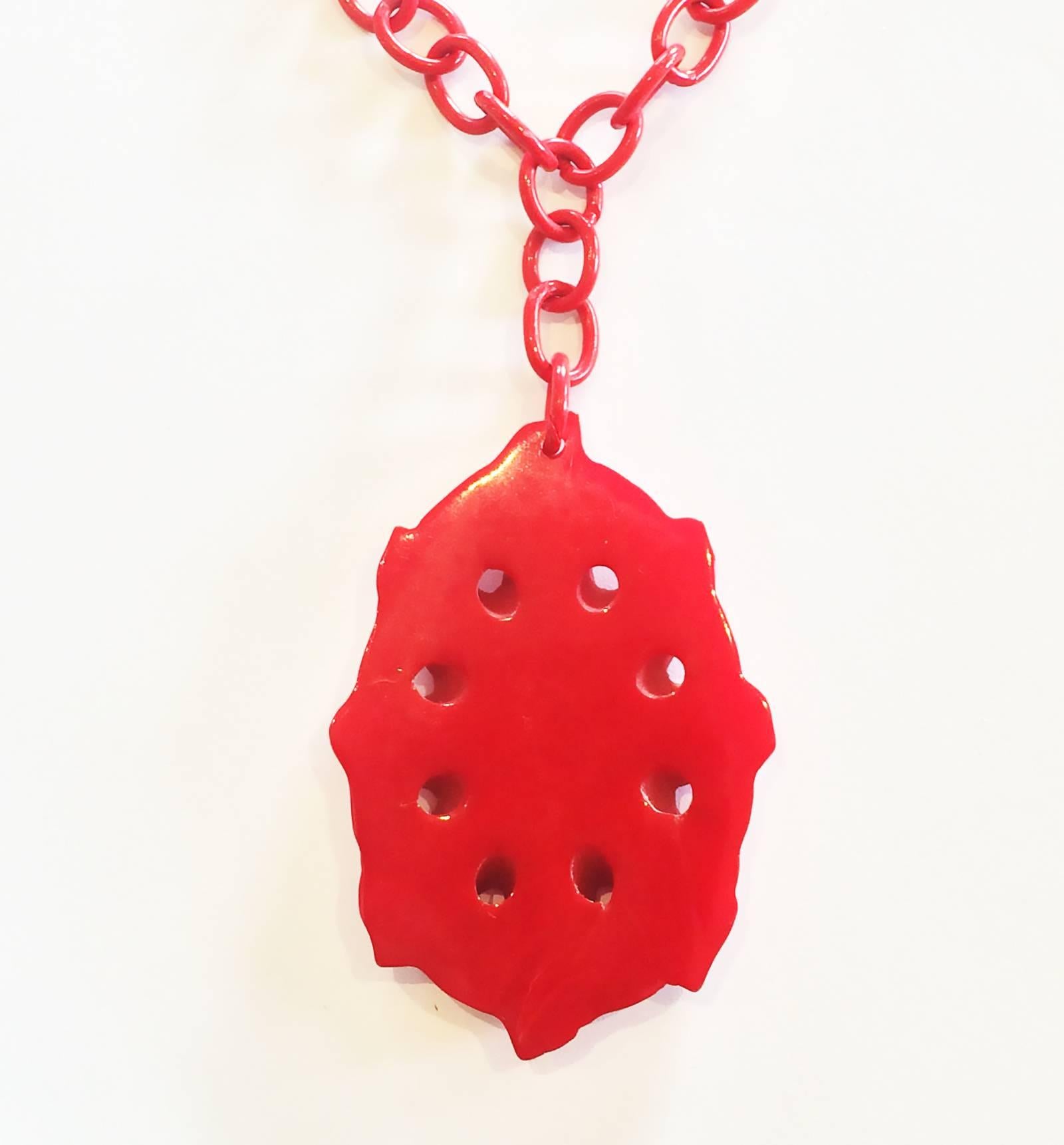 Art Deco heavily carved red bakelite pendant necklace on celluloid chain In Excellent Condition In Daylesford, Victoria