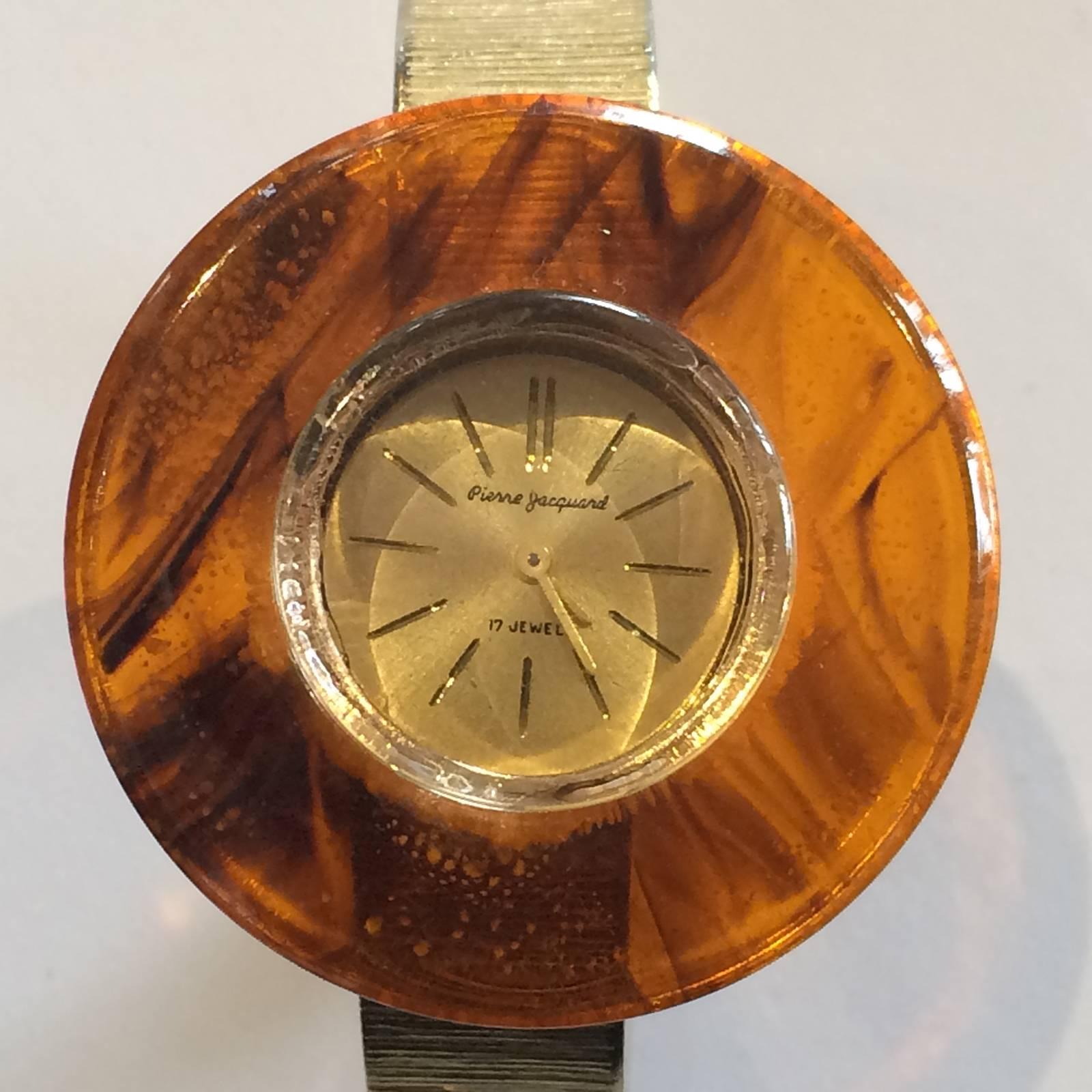 Mid Century, Honey Swirl Bakelite and Gilt Clamper Wrist Watch. All in excellent condition, with a fine, stippled surface to the Bakelite, keeping good time for age, checked, cleaned and timed. Slight age patina to rear of watch, but face is