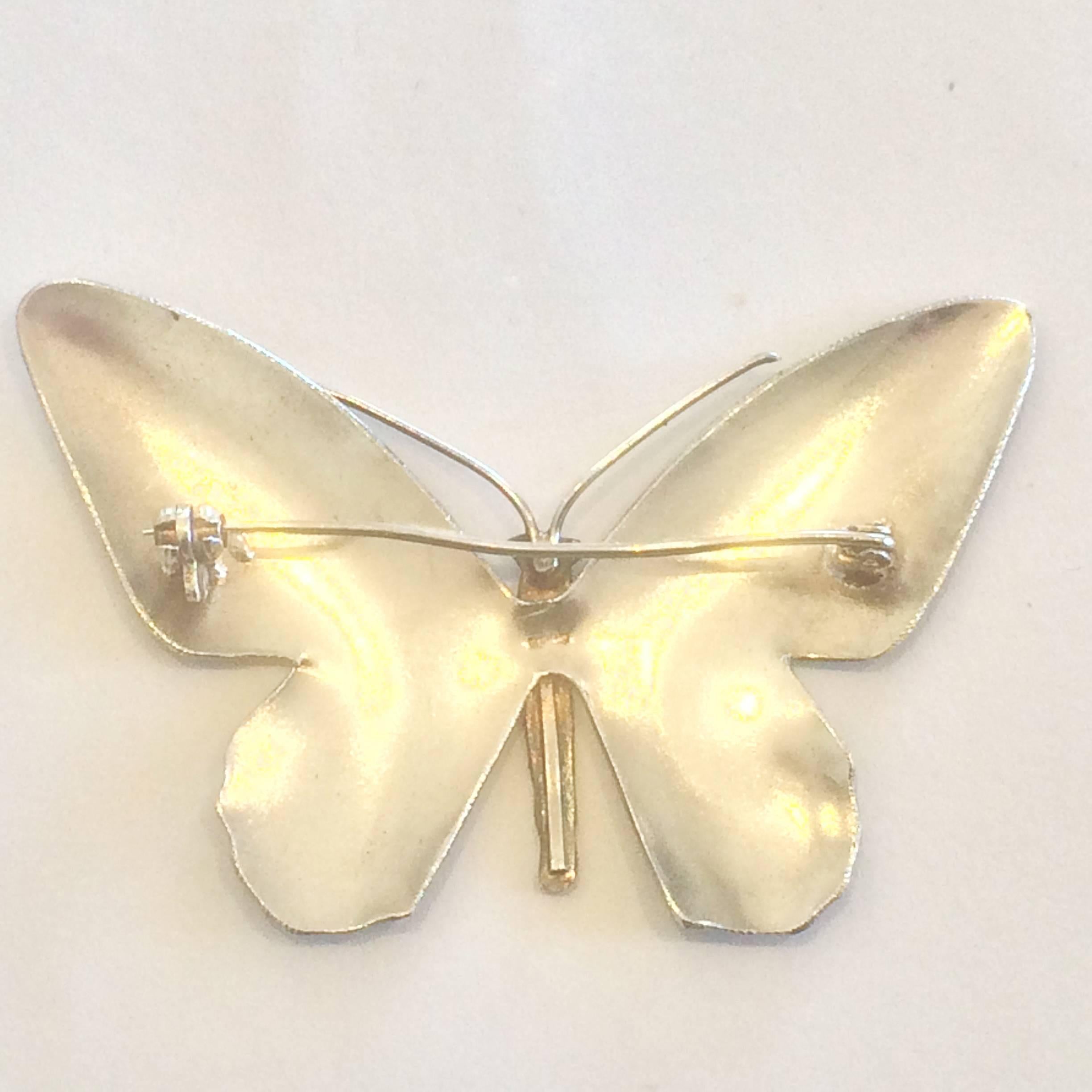 Art Deco Brooch in Sterling Silver with finely detailed Multi-coloured enamel, and original “roll-over” safety catch to rear. The Butterfly is actually shaped, and not just “flat” silver. The enamel is totally perfect with no losses or repairs. The