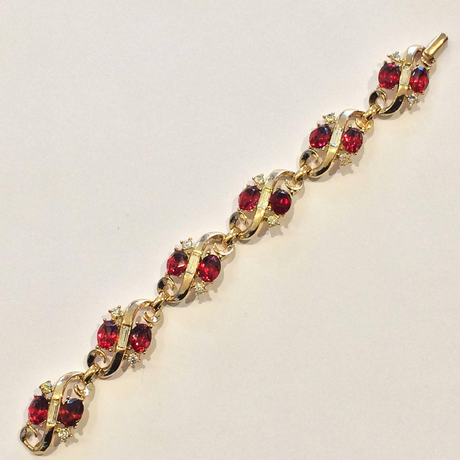Art Deco Bracelet made by Trifari, designed by Alfred Philippe. Stunning Gilt with extraordinary Red and White Diamantes. Design has Patent Pending and marked to the Clasp “TRIFARI” over “ PAT.PEND.”.  All in absolutely perfect condition with no