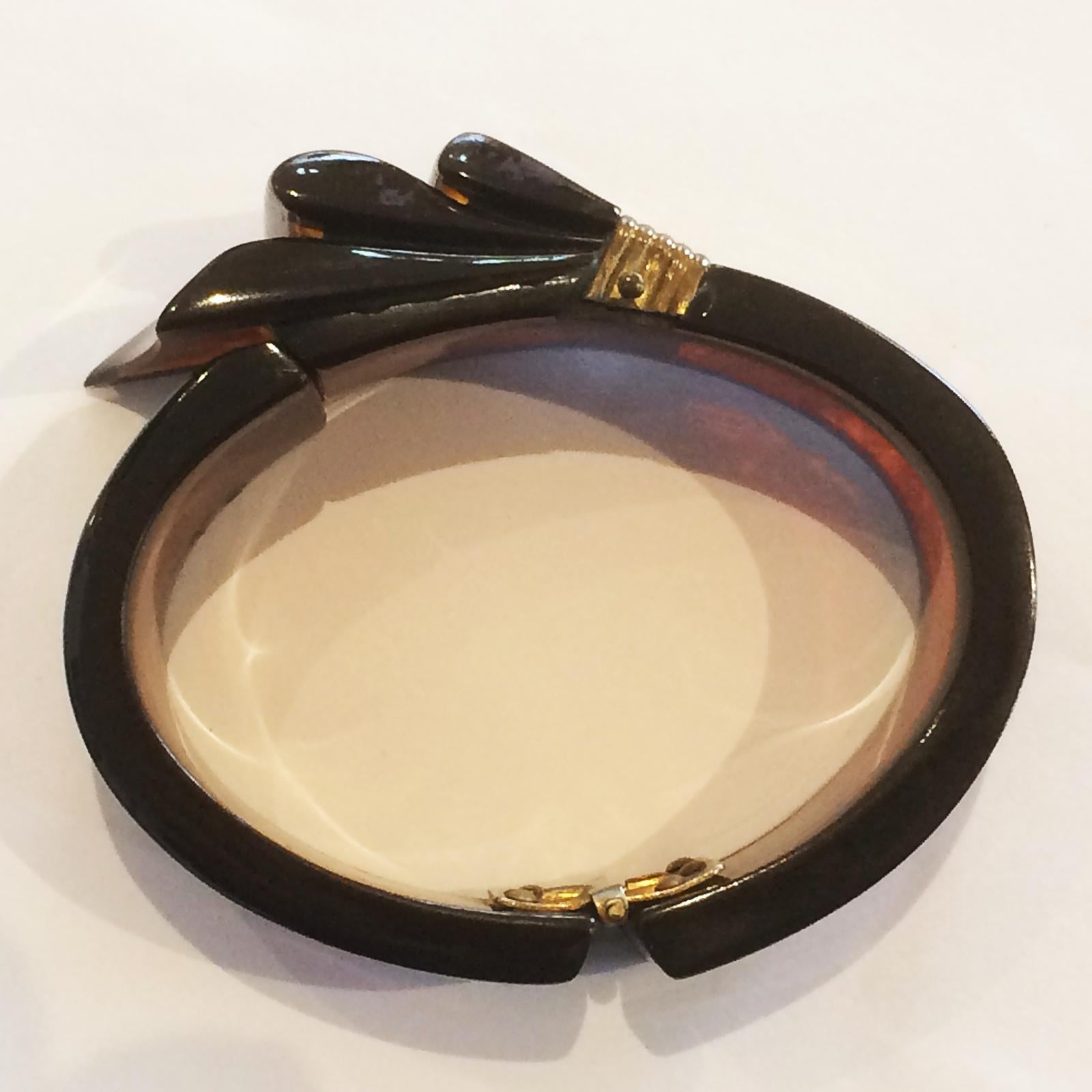 Women's Rare Art Deco Black and Root beer bakelite ribbon hinged clamper bangle For Sale