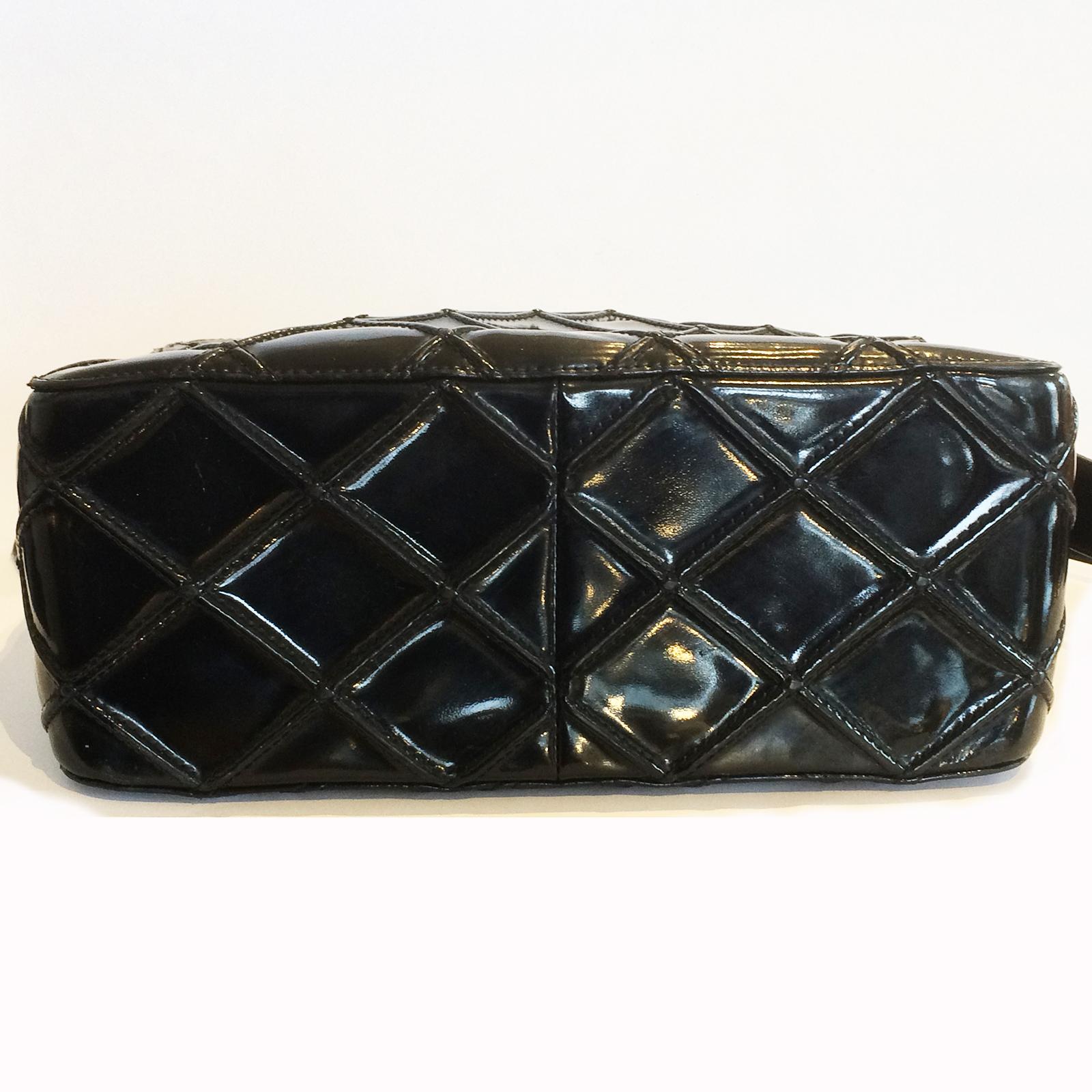 Vintage Authentic Chanel Handbag in Patent Leather, in “V” Stitch or Diamond Pattern, and an external pocket to the front and a “V” stitched outer zipper pull with the silver satin metal “CC” logo. All in amazing, as new condition inside and out,