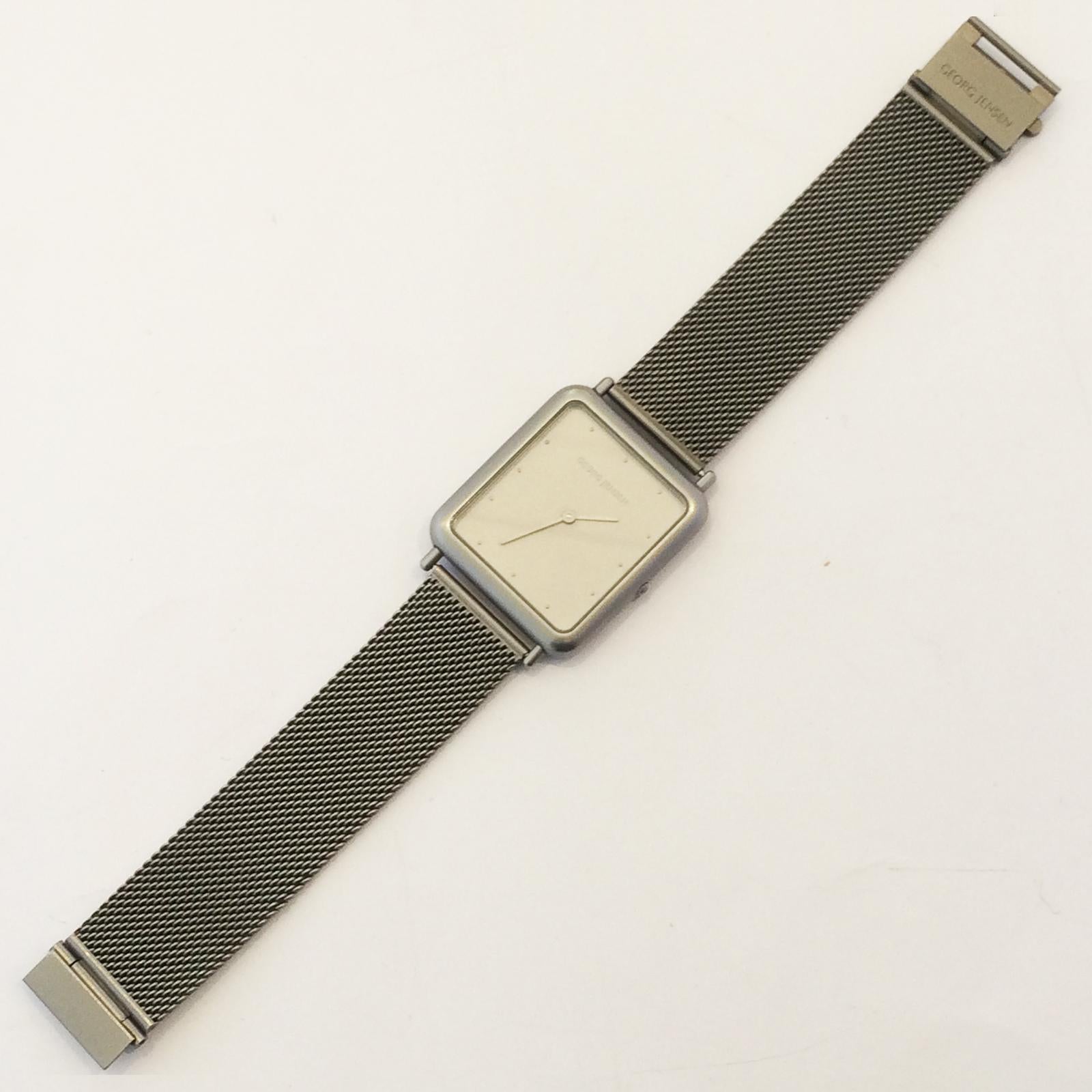 Original Georg Jensen Watch by Thorup & Bonderup, Quartz movement in pristine condition and keeping perfect time. It has a wonderful satin grey metal finish which in itself looks very elegant, particularly with the fine Chain Mail Band . Very simple