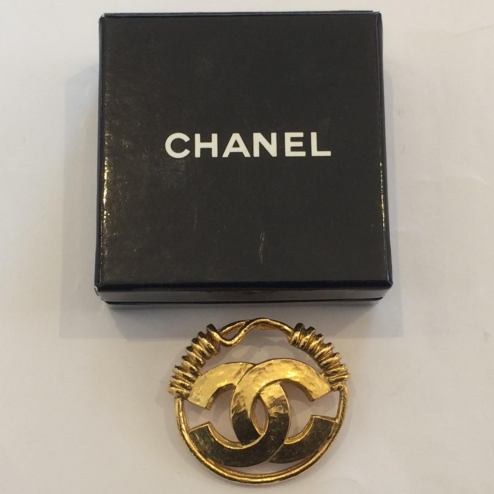 Authentic Chanel Brooch in 24ct Gold Plate with original Box. Amazing Craftsmanship, using the Internationally recognised Logo of “CC” with Coiled Rodd creating the closure of pin on both sides. Original “roll-over” safety clasp at rear pin in