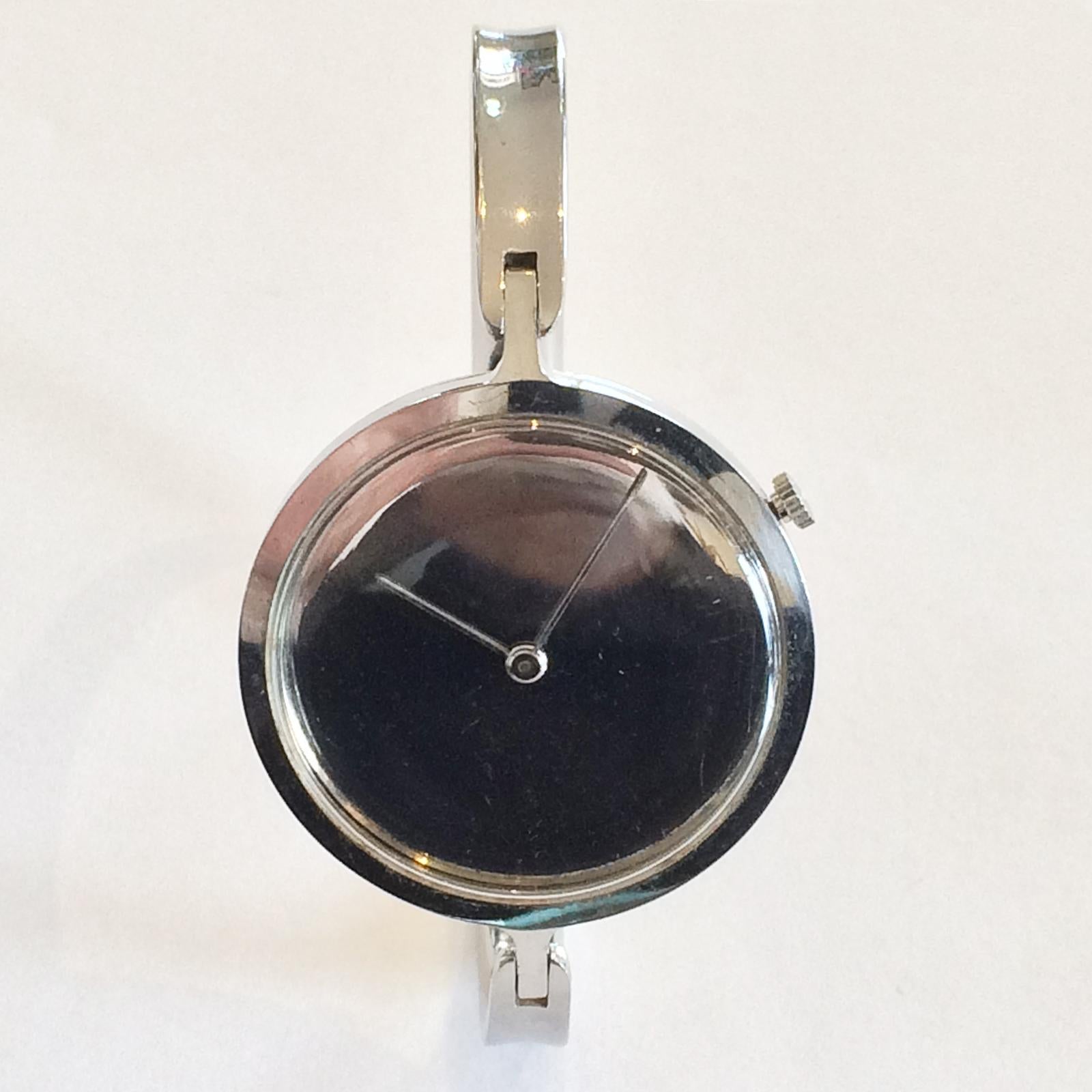 Authentic Georg Jensen Ladies Bangle Watch, Viviana Design No. 336 by Torun, Denmark. The original Crown offset to the 4 position, has raised, interlocked Initials “GJ”. This Analog watch is in excellent condition, for age, with a Swiss Quartz