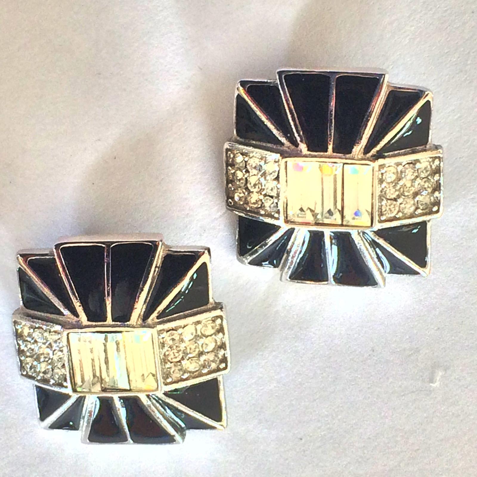 Art Deco Revival Clip Earrings Style by Givenchy PARIS and NEW YORK as marked to the rear. The face is in silver tones with Geometric black wedges of enamel within, surrounding central 3 Baguette cut Diamantes, with 3 x 3 brilliant white Diamantes